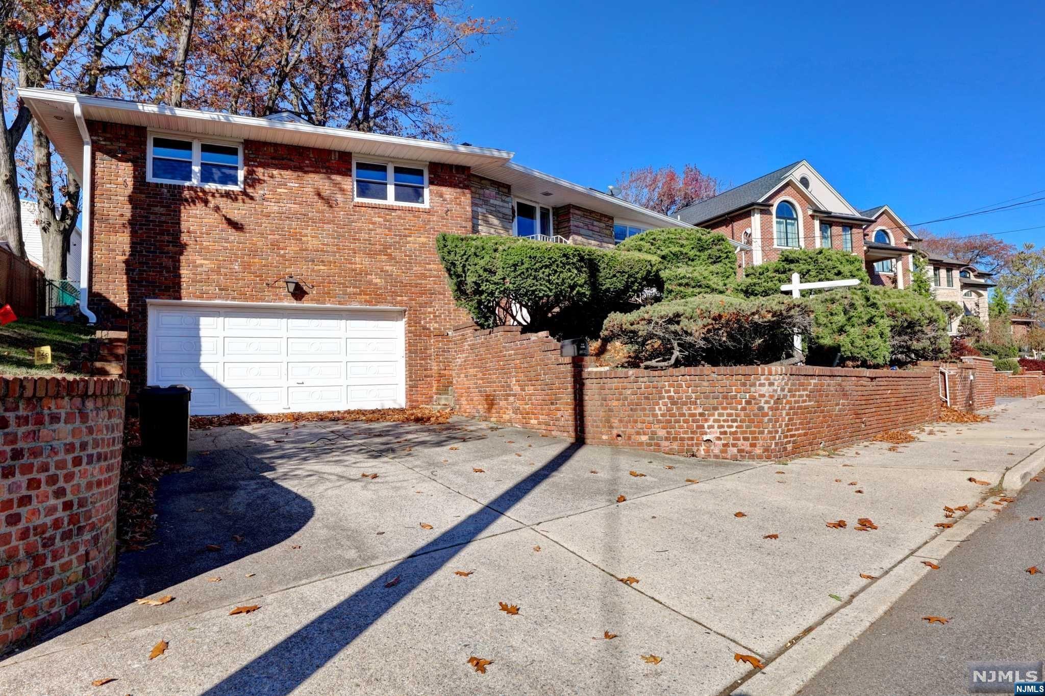 Four Bedroom Brick Home on Abbott Blvd facing east bright and Sunny with Beautiful large rooms, hardwood floors,Living room with large windows, Family room and dining room with a fireplace, modern eat in kitchen, Master bedroom ,master Bath Two additional bedrooms and an additional modern bath The lower level is great for entertaining,Family room, gym, home office a bedroom and a full bath, laundry room and a two car garage. The backyard is private and has a patio. Central air, gas heat.