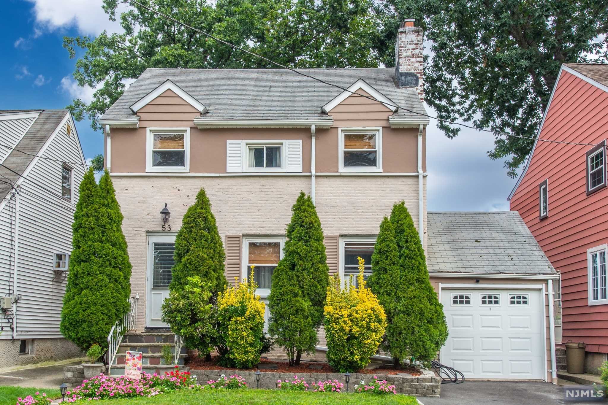 Welcome to this Spacious Side-Hall Colonial home with three bedrooms, two bathrooms, and an attached one-car garage sits on a level, on a tree-lined street in a desirable Allwood section neighborhood. First Floor features spacious living room with wood burning fireplace, where you'll see beautiful hardwood floors flowing throughout the home. The formal dining room adjoins the kitchen is cozy & ready to entertain. Updated Kitchen with stainless steel appliances. Immaculately maintained stairs lead to the second floor, which houses all three bedrooms and a full bath. Finished basement with a full bath, laundry room and large backyard with shed. Enjoy the convenient location close to schools, restaurants, major highways, and walkable transportation to NYC.