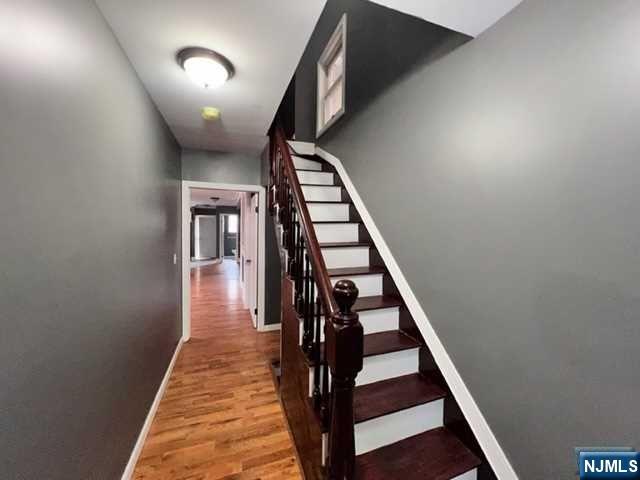 A rare find 5 bedroom, 4 baths single family home featuring 4 levels of living space. Beautifully renovated sun drenched colonial. Brand new everything! This amazing home offers an incredible open floor plan, living/dining room combination, dry bar with built in fire place, eat-in-kitchen with granite countertops and stainless appliances, gleaming hardwood floors throughout. 2 zoned heating and cooling. Lovely and private fenced in yard. Finished basement with convenient laundry room, 1/2 bath, recreation/yoga room and so much more.
