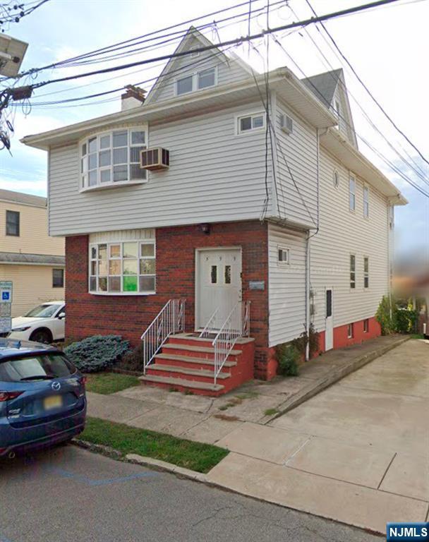 Investment Opportunity at 59 Wood Street, Garfield! This large 2-family home is an excellent choice for investors looking to generate rental income. Each unit offers spacious living areas, featuring a large living room complete with a cozy fireplace, ideal for tenants seeking comfort and charm. The 2nd floor features 3 bedrooms ready for you renovations to maximize rental profits. The property also includes a two-car detached garage, providing added value with potential for extra rental income or convenient off-street parking. With well-maintained exteriors and a prime location, this property offers great potential for consistent cash flow and long-term appreciation. Close to local amenities, schools, and transportation, this 2-family home is a must-see for investors looking to expand their portfolio