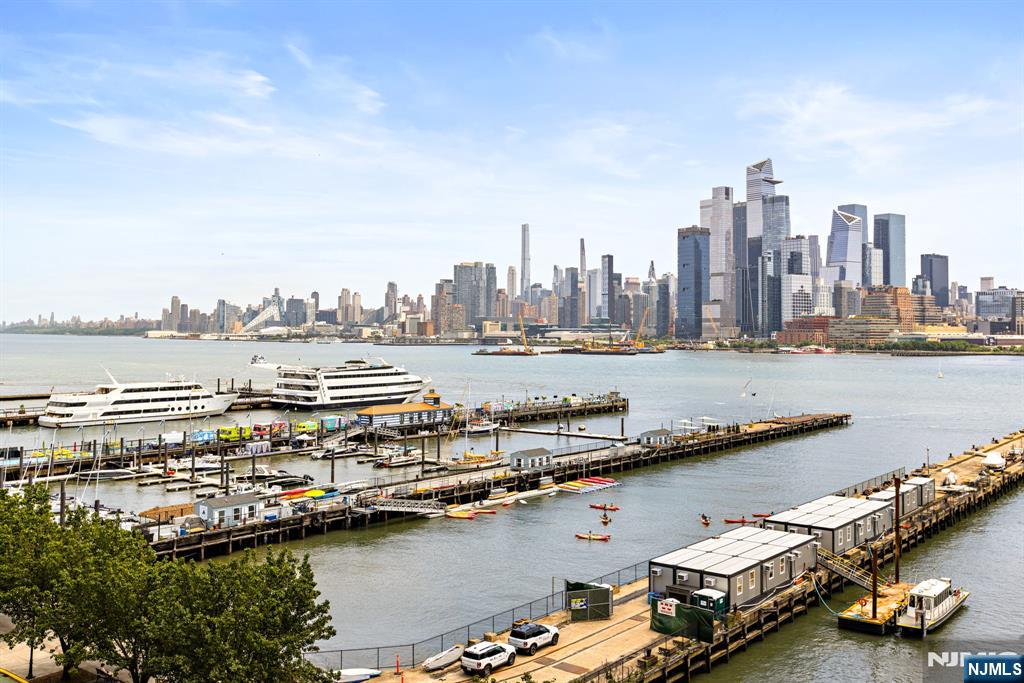 Incredible 1 bed + den/1.5 bath with NYC and river views in the luxury waterfront community of 1125 Maxwell Ln. Chefâ€™s kitchen includes granite countertops, custom backsplash, and center island. Spacious living & dining space features stunning views of the Hudson River & NYC skyline. The primary bedroom is large with matching closets, NYC views, and a ensuite bath with walk-in shower, dual sinks, and soaking tub. The den has custom built-in bookcases & murphy bed, making it a perfect office, guest room, or nursery. Also included is a half bath, hardwood floors, central AC, custom pantry closets and an in-unit washer dryer. The buildingâ€™s amenities include 24/7 concierge & security, 2 gyms, 2 pools, 2 playrooms, 2 rooftop decks with BBQ grills, community rooms, and shuttle service to and from the Path. Conveniently located near the NYC Ferry and bus stops, along with shops, restaurants, and everything that uptown Hoboken has to offer.