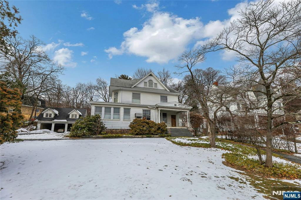 Historic 1895 Colonial style home with Endless Potential. Opportunity awaits with 3 floors of sprawling living space plus a basement, offering timeless architecture and the chance to restore a true classic to its former grandeur. With 7 bedrooms and 4 full and 1 half bathrooms, this expansive residence is ideal for investors, renovators, or visionaries seeking a statement property with historic charm. The home showcases many original elements ready to be revived, including generous room sizes, high ceilings, beautiful hardwood floors, period details, and traditional Colonial proportions. While the property is being sold as is and in need of renovation and updating, the scale and layout provide a strong foundation for a remarkable transformation. Adding to the value is a detached garage and living space above, also requiring improvements but offering incredible flexibility perfect for a multitude of possibilities. Set on a lot that complements its historic roots, this property presents a rare chance to reimagine a grand 19th-century home and create something truly special.