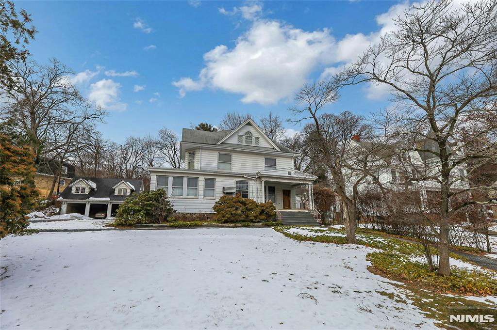 Historic 1895 Colonial style home with Endless Potential. Opportunity awaits with 3 floors of sprawling living space plus a basement, offering timeless architecture and the chance to restore a true classic to its former grandeur. With 7 bedrooms and 4 full and 1 half bathrooms, this expansive residence is ideal for investors, renovators, or visionaries seeking a statement property with historic charm. The home showcases many original elements ready to be revived, including generous room sizes, high ceilings, beautiful hardwood floors, period details, and traditional Colonial proportions. While the property is being sold as is and in need of renovation and updating, the scale and layout provide a strong foundation for a remarkable transformation. Adding to the value is a detached garage and living space above, also requiring improvements but offering incredible flexibility perfect for a multitude of possibilities. Set on a lot that complements its historic roots, this property presents a rare chance to reimagine a grand 19th-century home and create something truly special.