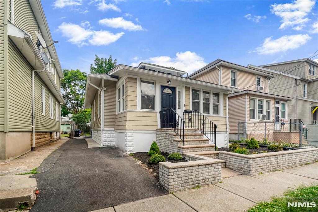 Tucked into the north west corner of Irvington 1 block from Maplewood is a sweet renovated and well cared for ranch that provides opportunity for home ownership. This home has a living room, Dining room, kitchen, 2 bedrooms and 2 with other flex spaces for living and working on the main level. It has laundry with washer and dryer on the main level an enclosed room in the front and back of the home that provide flex space for a home office. The deck off the kitchen and fenced in back yard with a shed as well as a driveway provide further useful amenities for enjoyable living. The finished basement has a half bath and 2 other rooms for further flex space. The renovations make this home move-in-ready! Renovations include fresh paint inside and out. Complete refinishing of basement. Updated bathrooms. LVP flooring.
