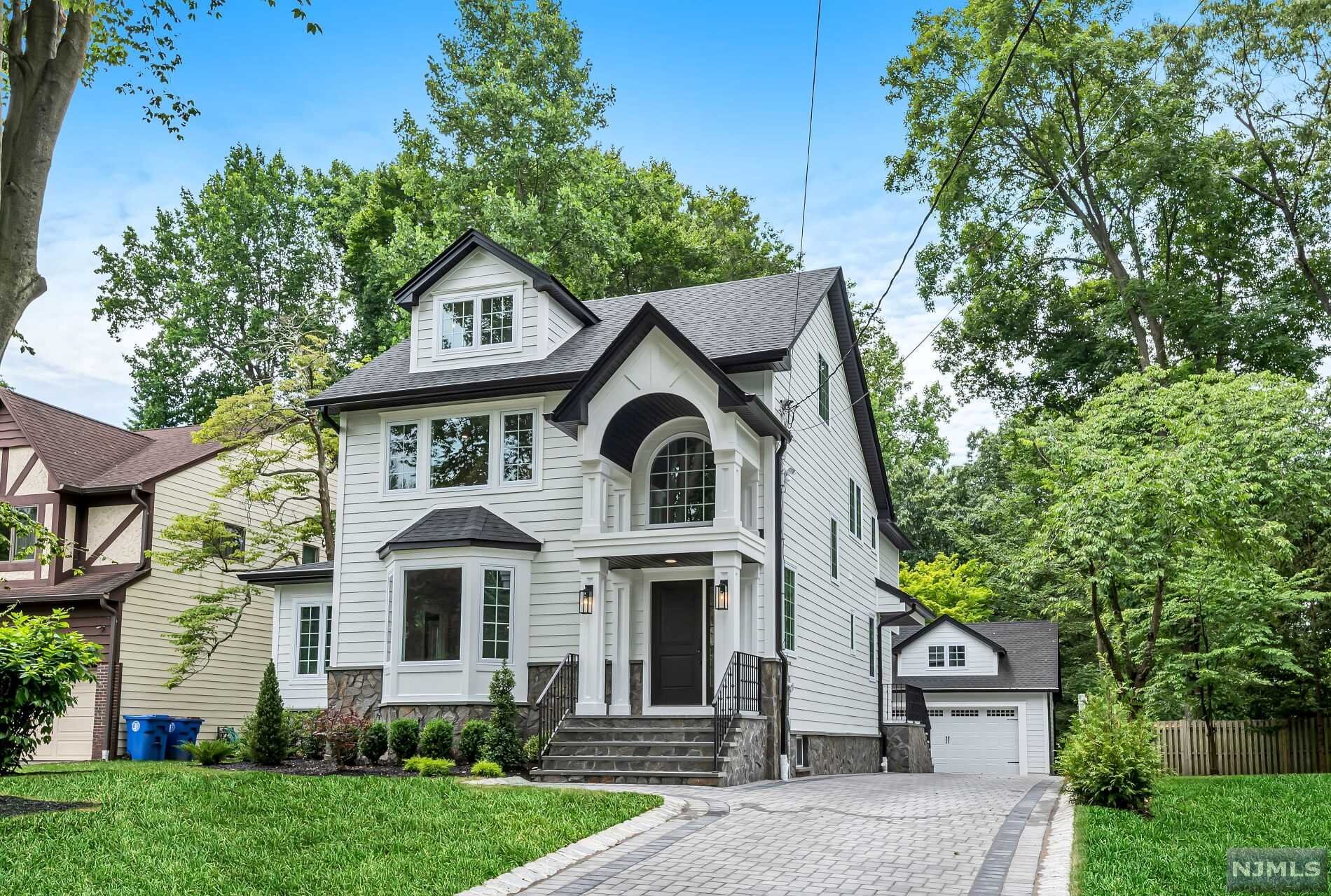 Welcome to this Beautiful New Construction Colonial Home on Existing Foundation for maintaining low property taxes in the desirable East Hill of Tenafly, NJ. Featuring the high-quality materials and craftmanship: Spray form insulation, Italian dolomite marble, Architectual moldings, Solid oak hardwood floors, Hardie-board with granite exterior. 1st Fl features marble Entry Foyer, Living Rm, Office, Powder Rm, Mud Rm, Gourmet Kitchen with 2 sinks/2 dishwashers, Wolf range top & double oven, built-in separate refrigerator/freezer with quartz counter-top, Carrera back splash, Dining area, Family Rm with custom bookshelves & fireplace. 2nd Fl features Master Suite, En-Suite, 2 bedrooms with Jack-N-Jill. 3rd Fl features 2nd Family Rm, Storage Rms. Basement features Bedroom with Walk-In Closet, Full Bath, Entertainment Area. Park like back yard has room for Inground Pool (not included). Close to NY City Bus, House of Worship and much more. Must-See. Owner has NJ Real Estate License.