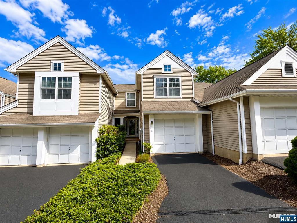 Price Improvement! This exceptional property is now offered at an even more attractive price, creating an outstanding opportunity for buyers looking for value. Welcome to Woodmont at Randolph, one of Morris County's most desirable townhome communities. This spacious two-bedroom, 2.5-bath townhome features an open floor plan designed for comfortable living and entertaining. The sun-filled living room offers a soaring cathedral ceiling and fireplace, creating a warm and inviting atmosphere. The large kitchen flows seamlessly into the dining and living areas, while sliding glass doors lead to a private deck overlooking scenic surroundings. Upstairs, you'll find two generously sized bedrooms, including a primary suite with a walk-in closet, plus a versatile loft ideal for a home office, reading area, or flex space. The fully finished walk-out basement with a full bathroom provides additional living space perfect for recreation, media, fitness, guests, or hobbies. Additional features include a level-entry attached garage with direct access, a separate laundry area, natural gas heat, central air conditioning, and ample guest parking. Residents enjoy a community playground and convenient access to shopping, dining, entertainment, parks, and major commuter routes, including NJ Transit service to New York City. Located within the highly regarded Randolph Township School District, this exceptional home offers the perfect combination of comfort, convenience, privacy, and community.
