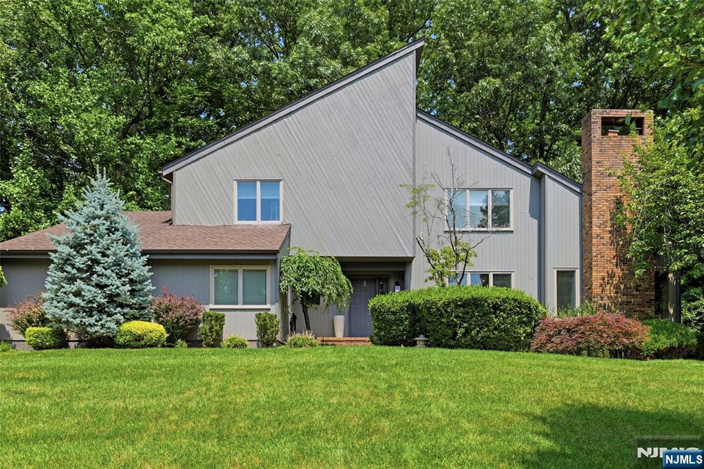 Spacious 5-bedroom home offering 2.5 bathrooms, multi-zone central air, finished basement, and a large deck suitable for outdoor enjoyment. The property includes two attached garages plus additional parking in the driveway, providing convenient options for multiple vehicles. The interior layout offers flexibility for various living needs, with generous room sizes and multiple areas for gathering or quiet use. Located near parks, shopping, dining, and major highways, offering easy access to everyday essentials and commuter routes. Set in Mahwah, a community recognized for its strong school system, extensive green spaces, and a welcoming residential environment that appeals to buyers seeking a comfortable home with room to grow. Residents enjoy exceptional community amenities included in the HOA, featuring an outdoor swimming pool, clubhouse, and sports courts.