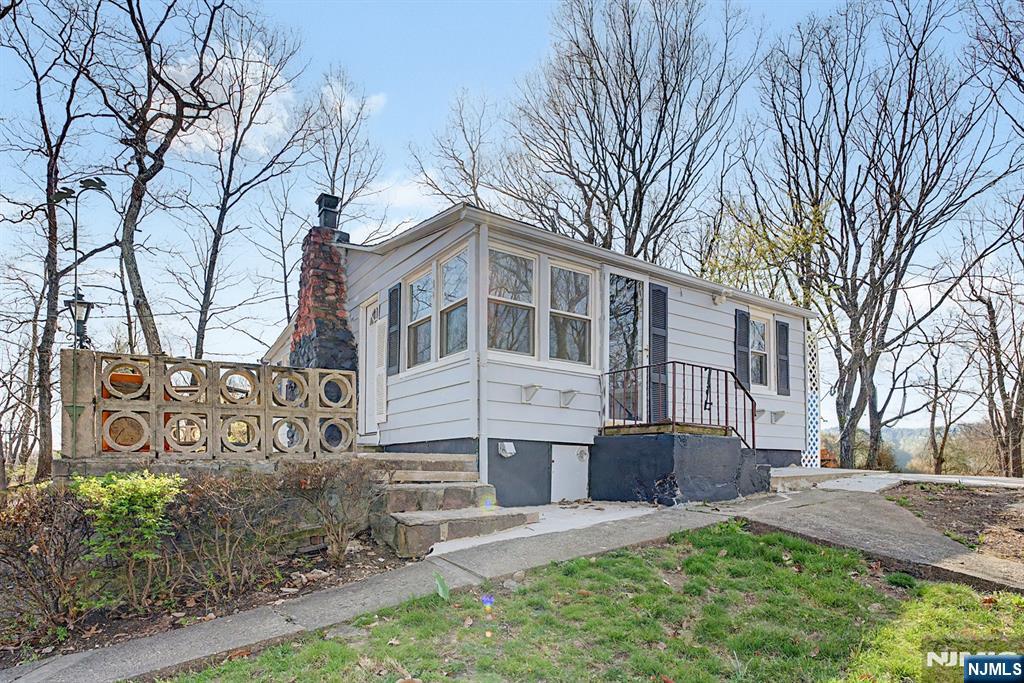 Move-In Ready Cottage with Expansion Potential: Charming, fully renovated 2-bedroom cottage set on over half an acre in Boonton Township. Features include a brand-new kitchen, updated full bath, and a spacious living room with a stone fireplace and wood-burning stove insert. The property also includes a private yard, large patio, and outbuilding. The oversized lot offers endless possibilities for expansion or building a larger home. Convenient location with access to recreation, shopping, and major highways. Zoned for Mountain Lakes High School.