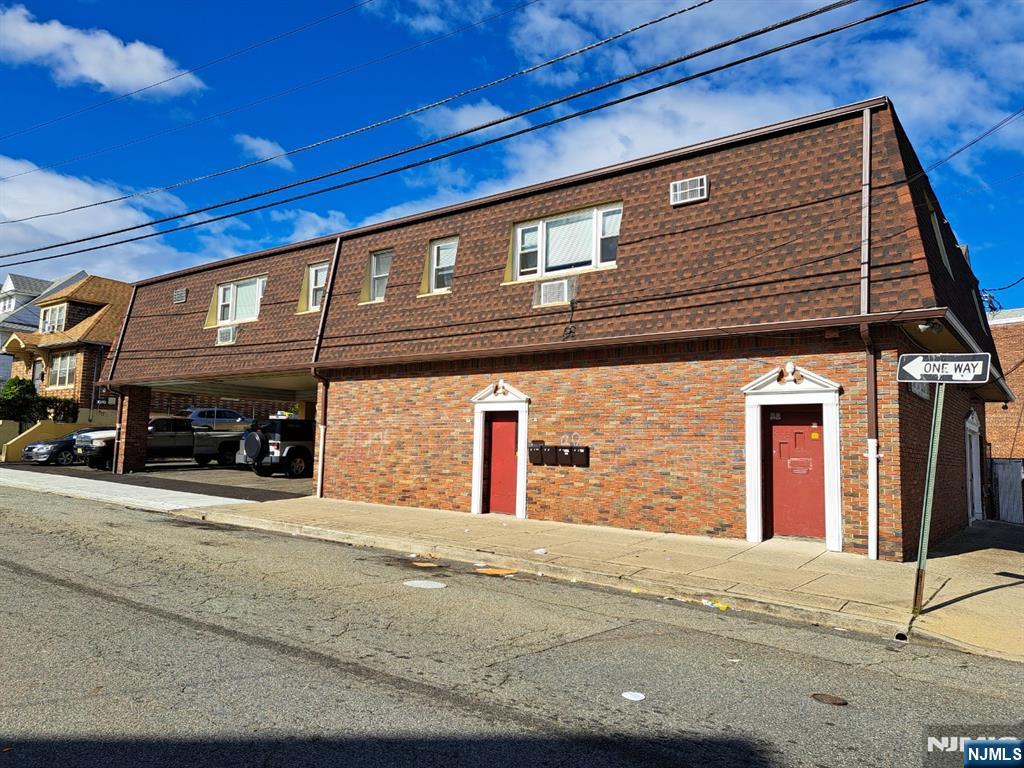 Brick & shingle mixed use corner building in the Great Falls District. Four one BR apartments plus an 1850sf first floor commercial space for an owner/occupant or rental income. All separate utilities plus 9 off street parking spaces. Three year old roof, shingle siding, and leaders and gutters. State and local inspections passed in 2024. Zoned R-3. Not in a flood zone. Growth potential and near the Totowa border.