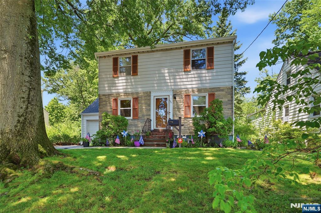 Nestled in Bloomfield's highly sought-after Oak View section, this beautifully expanded Colonial blends timeless charm, generous living space, and endless potential. Originally a Cape Cod, it has been thoughtfully transformed into a spacious 4-bedroom, 2-bath home designed for comfortable living and effortless entertaining. The main level features beautiful hardwood floors, a bright living room, formal dining room, spacious eat-in kitchen, first-floor bedroom, full bath, and a sun-filled sitting room overlooking the private backyard. Upstairs, you'll find three generously sized bedrooms, including a spacious primary suite with new flooring, oversized his-and-hers closets, and the opportunity to create your dream en-suite bath. The additional bedrooms also feature new flooring and abundant natural light. A partially finished basement provides additional living space, while the unfinished area offers ample storage and future possibilities. A one-year-old roof adds peace of mind, and the spacious backyard is perfect for entertaining, gardening, or relaxing outdoors. Conveniently located near parks, shopping, restaurants, schools, major highways, and NYC transportation, this exceptional home offers the perfect combination of location, space, and opportunity in one of Bloomfield's most desirable neighborhoods.