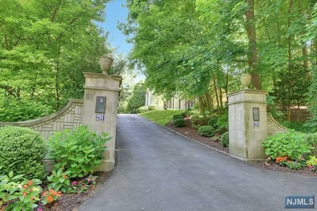 Exquisite Masonry Stucco, Center Hall Colonial, with Incredible Architectural details throughout. As you enter this home, you are welcomed into a Magnificent Entry. Formal Living room, Formal dining room, Mahogany library, beautiful office and light filled solarium. Butler's pantry. Chef's Kitchen, Breakfast area, all with breathtaking views of the property. This home is nestled in a very private, lushly landscaped 1.6 acre property, on a premier Englewood street. In-ground pool, surrounded by Stone patio, and Specimen plantings. This home offers over 8200 sq. ft, of luxurious, living space. The Second floor boasts a Lavish Master Bedroom Suite, with his & her bathrooms plus 4 additional bedrooms and 3 full bathrooms. This is a home, that you don't want to miss! Prime location on the East Hill of Englewood.