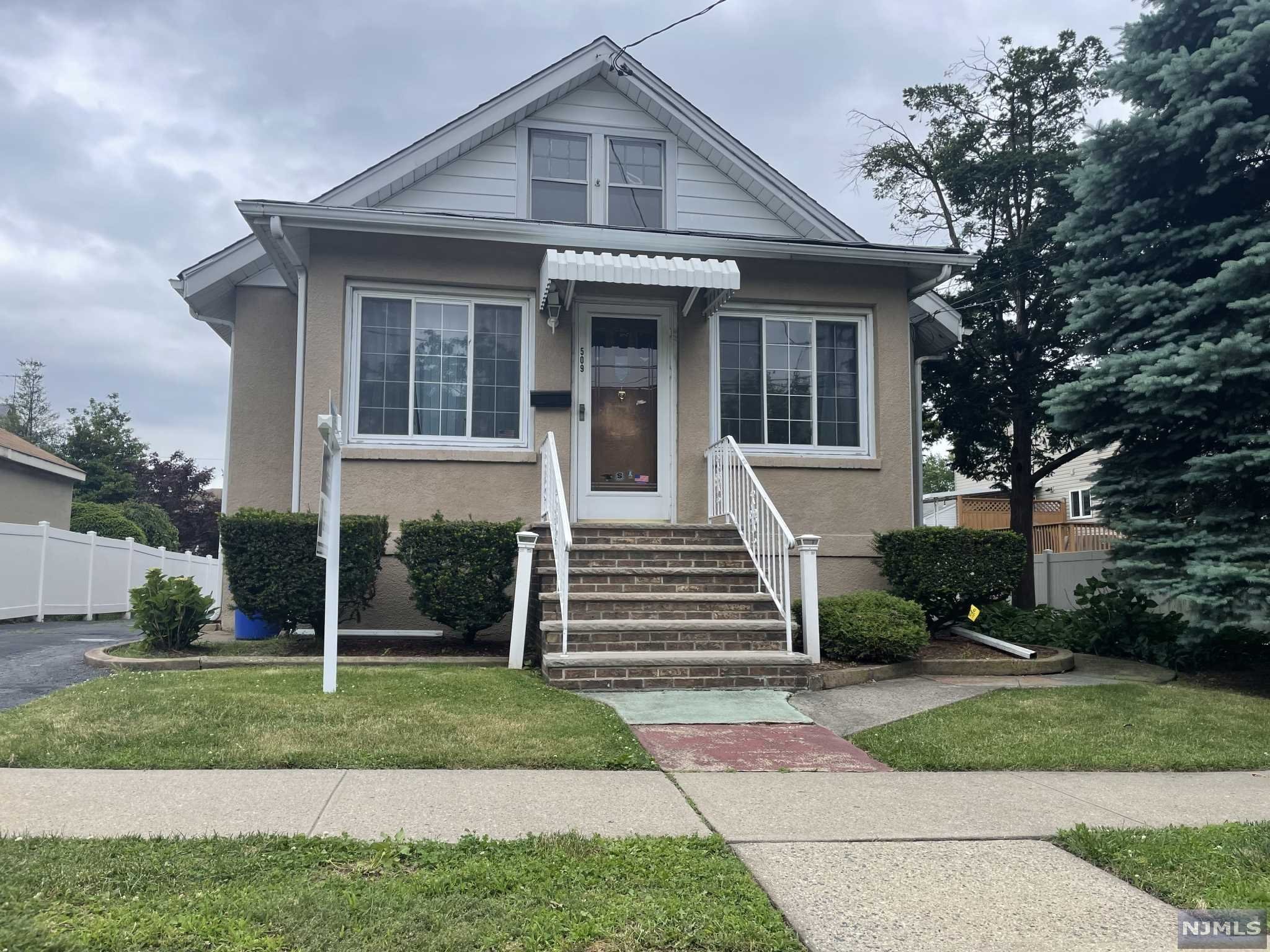 Welcome to the quiet suburb of Carlstadt, with low taxes, lots of parks, and close to everything! This charming home has 2 large bedrooms on the first floor, full bath, and beautiful natural wood trim throughout the living room and dining room. The second floor has lots of storage space and 2 more bedrooms. The basement has lots of options to finish off and make it your own. It's a commuters dream! NYC transportation right outside your front door! Come see it