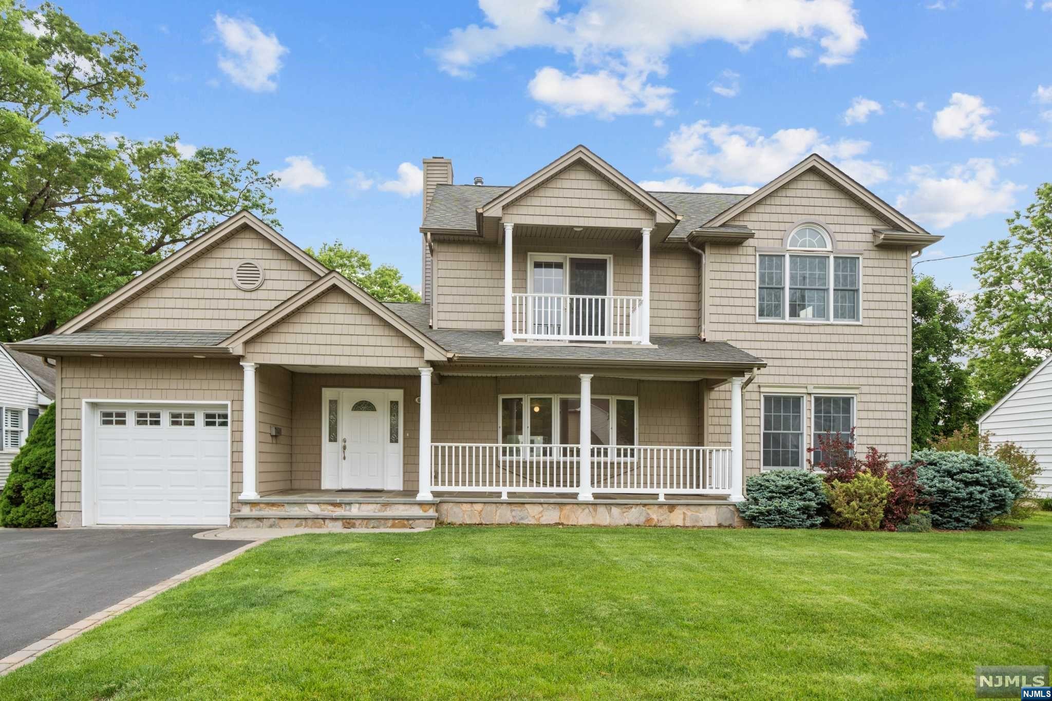 Welcome to the beautiful town of New Milford, highly sought neighborhood. This gorgeous home is sure to impress. Located in the Northeast side close to Oradell border, close prox to the golf course. Large driveway w a single oversized garage w access to the kitch. Enjoy your coffee on the beautiful frt cov porch w bluestone covering. As you enter, you are greeted by the entry foyer w cathedral ceiling, followed by a LR, DR, large FR w cath ceiling & fireplace, a fbath, an eat-in kitchen w skylight & SS appliances, sliding door to access a large yard perfect for entertaining, an on-suite w fbath & jacuzzi and 2 other bedrooms. 2nd floor features the primary bedroom w high ceilings, w fbath & jacuzzi, an office & a gym room w balcony to enjoy the beautiful neighborhood. Just refinished Hardwood floors throughout & freshly painted inside the house. Full finished basement w plenty of storage & a powder room. Close proximity to the train station, schools, shops & major highways to NYC.