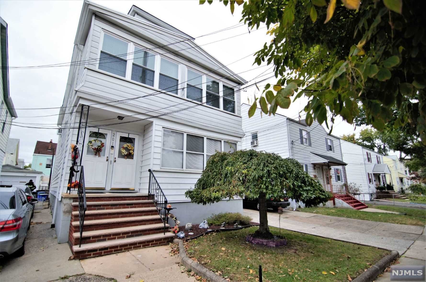 TWO FAMILY OFFERING 4 TOTAL BEDROOMS, 2 TOTAL LIVING ROOMS, 2 TOTAL DINING ROOMS, 2 TOTAL KITCHENS, 2 TOTAL FRONT PORCHES, LARGE UNFINISHED BUT CLEAN BASEMENT WITH A PRIVATE ENTRANCE FROM THE BACKYARD, DRIVEWAY AND DETACHED GARAGE FOR 2 CARS AND SEPERATE ENTRANCES AND EXITS FOR BOTH UNITS