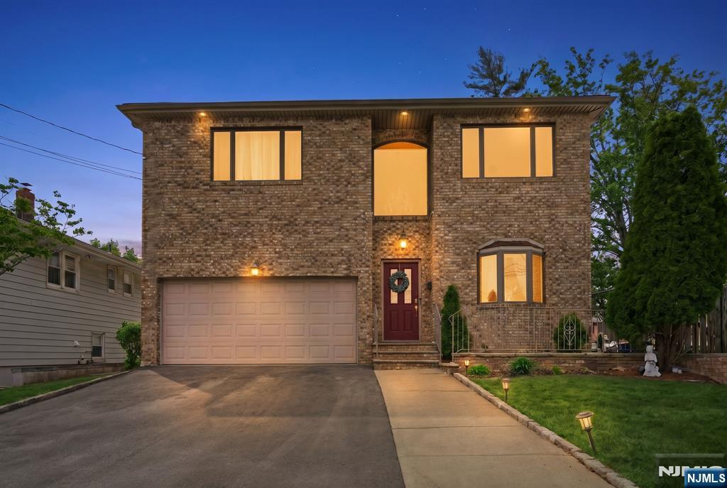 Welcome to this beautifully updated 5-bedroom Colonial designed with comfort, space, and flexibility in mindâ€”perfect for extended living. Step inside to a bright and inviting entry foyer that opens to an open-concept living room, dining room, and kitchen, creating an ideal layout for both everyday living and entertaining. The first floor also features a family room with a gas fireplace and a convenient half bath. Upstairs, youâ€™ll find a spacious loft area, three generously sized bedrooms, a full hall bath, and a primary suite complete with its own full bath and walk-in closet. The second floor also includes a home office and laundry area, offering convenience and functionality for todays living. What truly makes this home unique is the separate entrance leading to a private in law-suite. This space includes one bedroom, a beautifully updated kitchen, comfortable living area, and its own laundry, providing both privacy and independence. Additional highlights include solar panels for energy efficiency and a prime location close to major highways, public transportation, and a vibrant downtown area filled with restaurants and shops. This versatile and spacious home offers the perfect blend of style, functionality, and location.