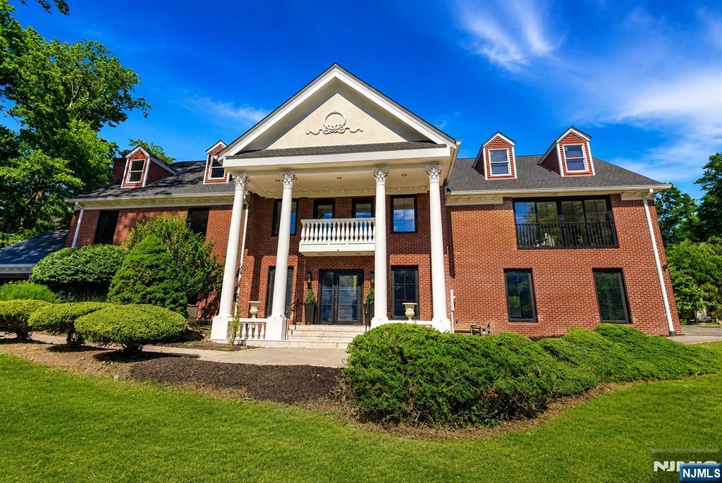 Welcome to this fully renovated grand brick colonial in Upper Saddle Riverâ€™s sought-after Northern Highlands school district. Set on a tree-lined street with serene pond views, this 5-bedroom, 4 full and 1 half bath residence offers over 5,696 sq ft of refined living space, plus an unfinished third level with 1,600+ sq ft of high-ceiling recreational potential. Recently transformed with major luxury upgrades, the home features a new roof, HVAC, septic, full-house filtration, custom windows and doors, frameless garage doors, 6-inch white oak floors, high-end appliances, custom millwork, new bathrooms, wet bar, wine rack, and designer finishes throughout. A dramatic foyer and grand staircase lead to formal living and dining rooms, private study, spacious family room with fireplace, beautifully appointed kitchen, and bright breakfast area. Custom full-opening sliding glass doors create seamless indoor-outdoor flow to the patio, grounds, and pond views. Upstairs, 5 bedrooms include a luxurious primary suite with vaulted ceilings, walk-in closet, spa-like bath, steam shower, soaking tub, and private retreat feel. The third level offers rare flexibility for a theater, golf simulator, gym, lounge, wet bar, or recreation space. Complete with level grounds, landscape design ready, 3-car garage, whole-house generator, and convenient access to shops, restaurants, Route 17, and NYC transportation, this renovated estate delivers space, quality, and lifestyle in one exceptional home!