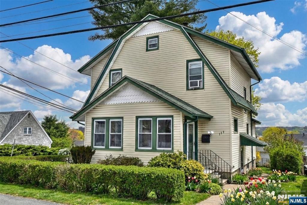 Step inside this bright and sun-drenched 3 bdrm, 3 bth Colonial in Teaneck. Perfectly move-in ready, this home combines classic architectural charm with a refreshing, airy feel. This home boasts an open concept, bright ample windows and recessed lighting throughout. The first floor features white tile flooring and a modern full bath with a rainfall shower, bench seat & LED anti-fog mirror. Two tone cabinets with a roomy pantry and new appliances make this kitchen ideal for entertaining and family gatherings. A finished basement adds significant living space with a modern full bath, perfect for extended family visits. Step outside to a backyard, ideal for relaxing, entertaining and enjoying the fresh start of Spring. Enjoy vibrant shopping downtown and close proximity to local gems like Overpeck Park & the Teaneck Creek Conservatory. Close to Ridgefield Park, the home offers an easy commute to NYC while offering the warmth & appeal of suburban living. A new roof completes the package. This will not last!