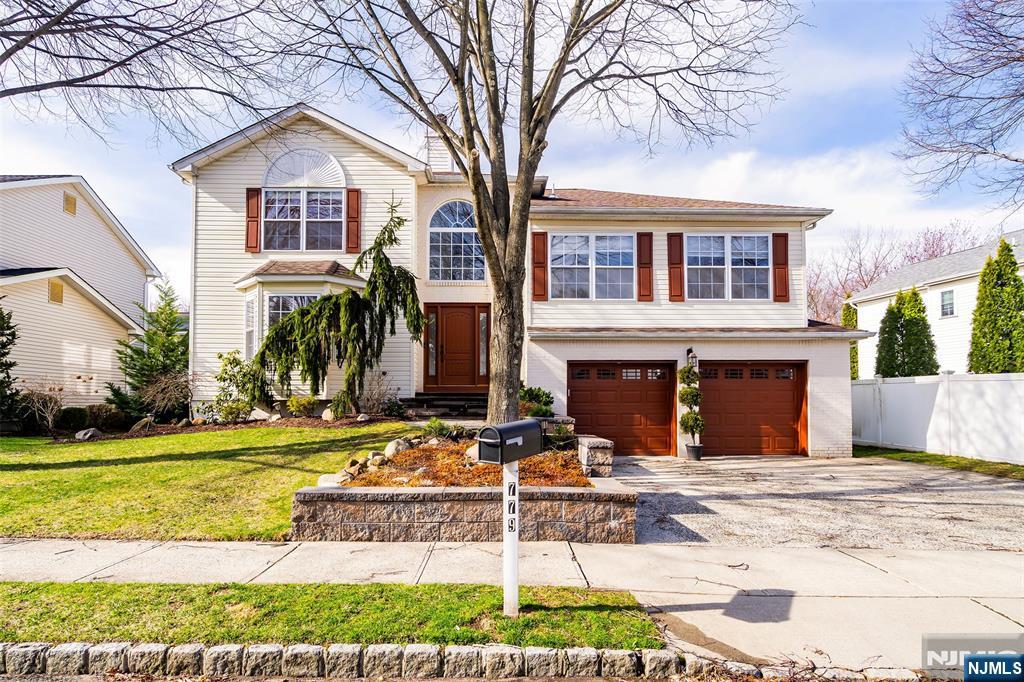 Spacious and modern Split-Colonial in fabulous Paramus location! The first floor boasts two story entry foyer with marble flooring, living room with gas fireplace, formal dining room and newer eat-in kitchen overlooking ground level den with sliders to a lovely yard. Three spacious bedrooms and updated full bathroom on the second level. Stunning primary suite boasts vaulted ceilings, huge primary bathroom with oversized soaking tub plus separate stall shower, and walk-in closet. Access to the semi-finished basement with half bathroom and laundry is found off of the two-car attached garage. Hardwood floors throughout, central air, beautiful finishes! Credit check and proof of income required with all applications. No pets. Tenant pays all utilities, landscaping and snow removal. Corporate rentals welcome.