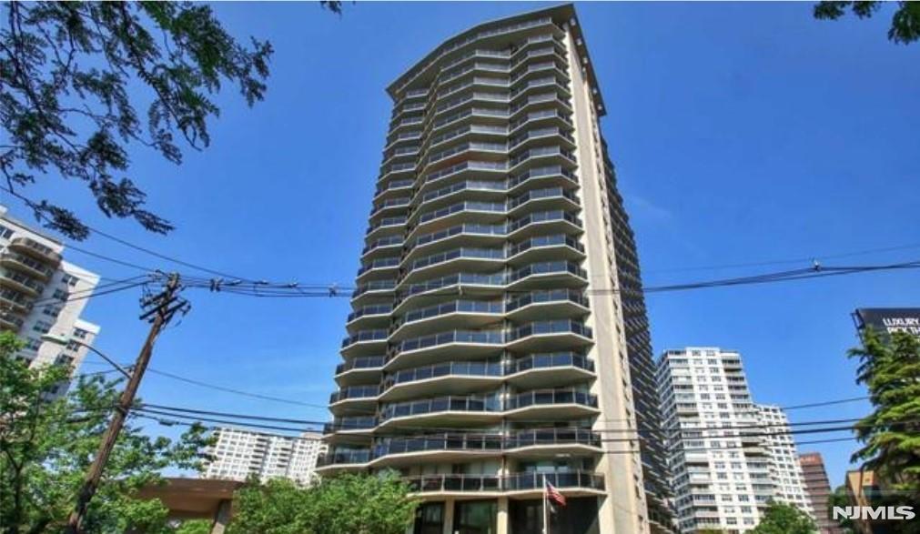 Spacious and well-maintained one-bedroom residence comprising of approximately 865 square feet, located on the 26th floor of a full-service cooperative building in Fort Lee. The unit features a bright and open layout with a large living and dining area, hardwood flooring in the main living spaces, and access to a massive private terrace offering views of the George Washington Bridge. Additional highlights include abundant closet space and included covered parking. The monthly maintenance is $1,555, with approximately 40% considered tax deductible. The Pembroke provides a range of amenities, including a 24-hour doorman, fitness center, outdoor pool, on-site laundry, and a live-in superintendent. The property is conveniently positioned near the George Washington Bridge, shopping centers, dining options, IPIC Theatre, major highways, and public transportation with direct access to New York City. Pet policy permits animals up to 25 lbs. Come see this amazing space waiting for you to make it your own.