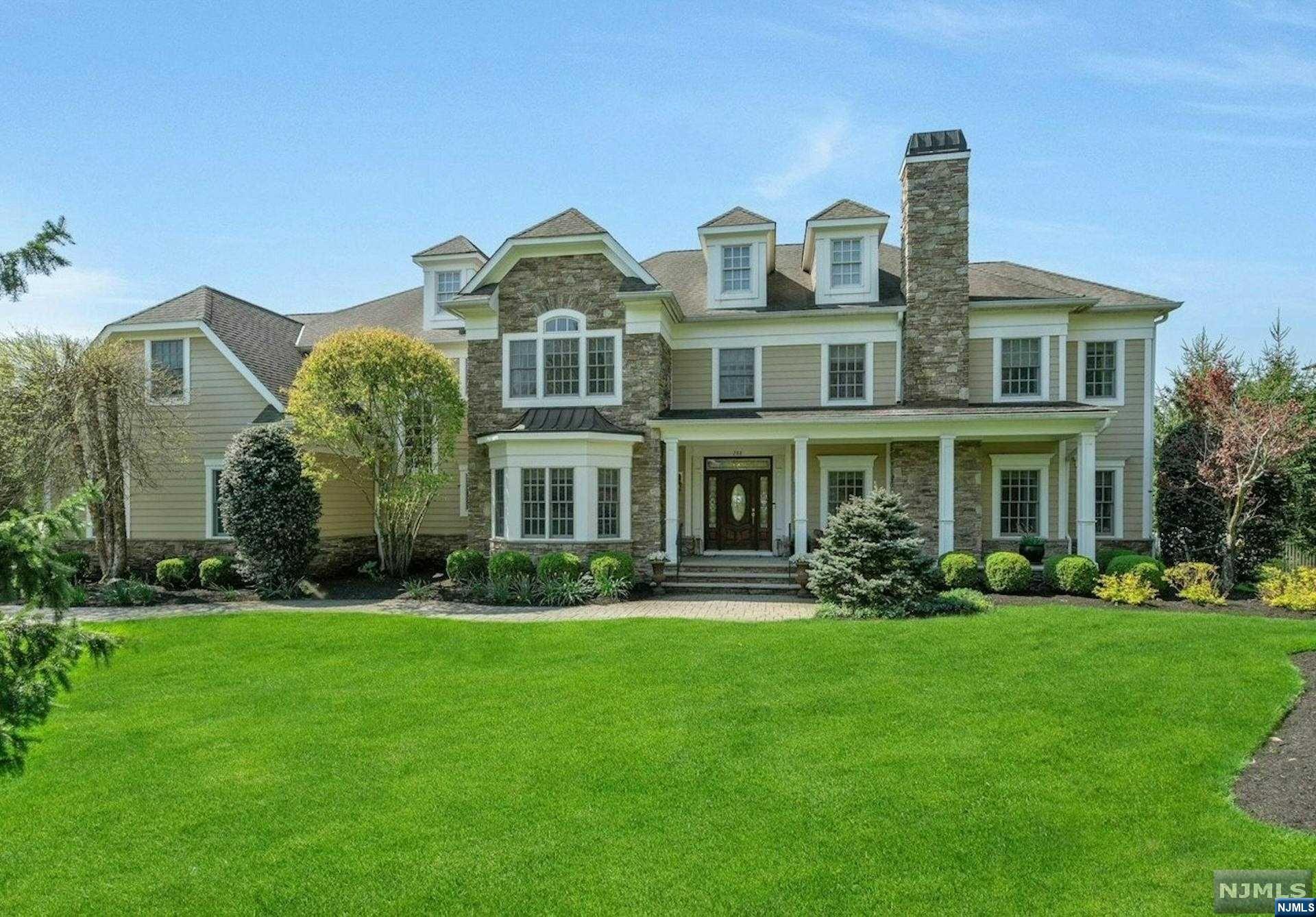 Nestled in Franklin Lakes, this captivating Nantucket-inspired residence embodies timeless elegance on a sprawling 1-acre property. This exquisite home offers both luxury & comfort. Its exterior features stone & hardiplank, expansive windows & picturesque landscaping, creating a welcoming ambiance. The interior is adorned with high-end finishes, rich hardwood flooring, intricate moldings & designer touches. The spacious floor plan seamlessly blends traditional charm with modern amenities, providing the perfect setting for both intimate gatherings & grand entertaining. The gourmet kitchen is a chef's delight with top-of-the-line appliances, custom cabinetry, & a large center island. Each bedroom ensuite is a peaceful retreat with ample natural light, The lush grounds offer a private oasis, manicured lawns & a tranquil patio ideal for al fresco dining or relaxation. This remarkable property epitomizes luxurious living & offers a rare combination of sophistication, serenity & style!