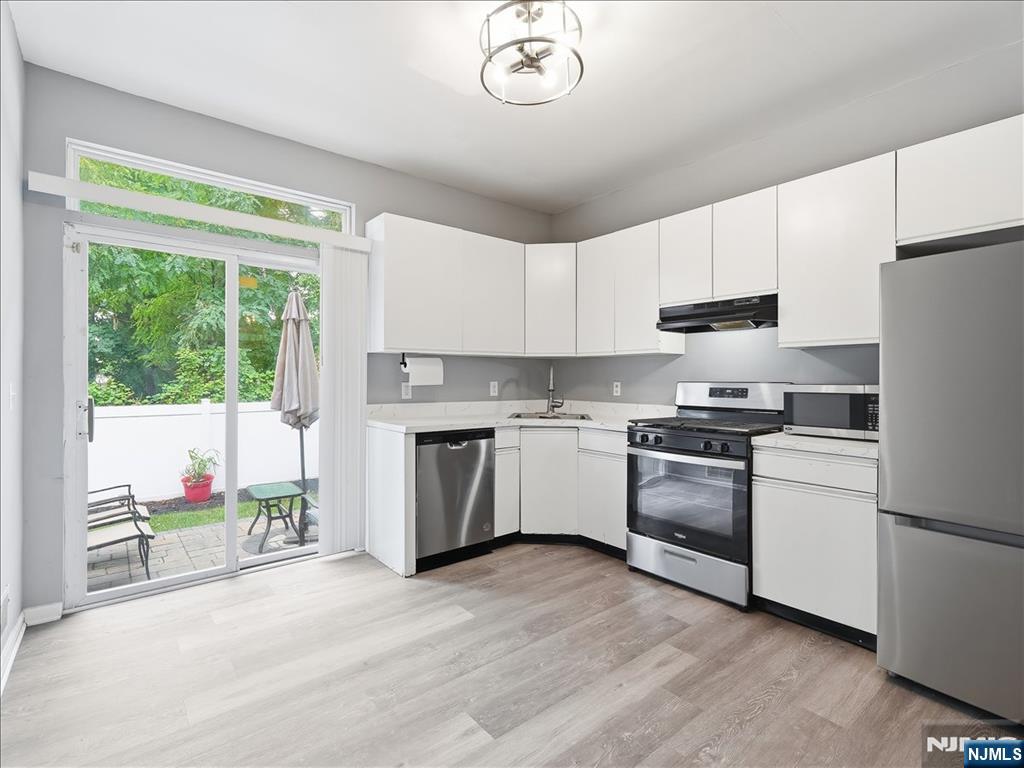Welcome to 4 Derby Street! This well-maintained, interior-unit townhome is tucked away on a dead-end street. The first floor offers a comfortable living room with a cozy fireplace, an eat-in kitchen featuring newer appliances, and direct access to a private backyard patio perfect for grilling, relaxing, or entertaining. You'll also find a convenient first-floor laundry closet, a half bathroom, and additional storage. Upstairs are two generously sized bedrooms, including a spacious primary suite with high ceilings and two closets. A full bathroom and pull-down attic access provide even more functionality and storage.Ideally located just minutes from South Orange, public transportation, and the VA Hospital, this home offers the perfect blend of comfort, convenience, and low-maintenance living. Schedule your tour today!