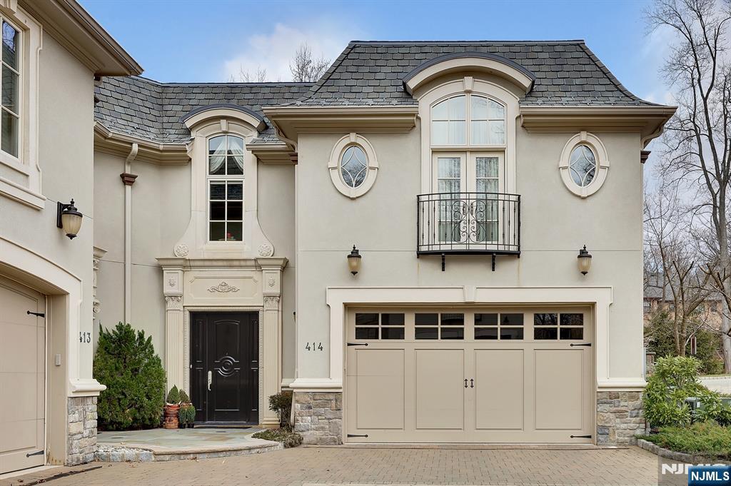 EXCEPTIONAL ELEGANCE IN THIS STUNNING BELLAIRE TOWNHOUSE, NESTLED IN THE HIGHLY SOUGHT-AFTER GATED COMMUNITY NEXT TO ALPINE CC. SURROUNDED BY LUSH GREENERY ON THREE (3) SIDES, THE MOST PRIVATE N SERENE SETTING WITHIN THE BELLAIRE ENCLAVE. THIS HOME OFFERS 6,000 SF OF TIMELESS EUROPEAN CHARM N MODERN SOPHISTICATION. A CHARMING INTERIOR W/ ELEGANTLY DESIGNED CURVED STAIRCASE, BEAUTIFUL HARDWOOD FLOORS, CUSTOM MOLDINGS, N TRIM WORK, N HIGH CEILINGS. OPEN FLOOR PLAN W/ ELEVATOR TO ALL 3 LEVELS. CUSTOM MAHOGANY LIBRARY W/ COFFERED CEILING. GOURMET EAT-IN KITCHEN W/ TOP OF THE LINE APPLIANCES, SUB ZERO N VIKING, W/CENTER ISLAND. DINING AREA, GREAT RM W/FIREPLACE. A CLASSY PRIMARY SUITE W/ A SEPARATE SITTING RM, A SPA-LIKE PRIMARY BR N A GENEROUS WALK-IN CLOSET. 3 ADDITIONAL EN-SUITE BRS, INCLUDING A PRIVATE LOWER LEVEL 4TH BR SUITE. LOWER LEVEL HAS A HOME THEATER N A SPACIOUS FAMILY RM. THIS EXCEPTIONAL LUXURY TOWNHOUSE IS TRULY BEYOND DESCRIPTION AND YOU MUST SEE! Watch the aerial video.