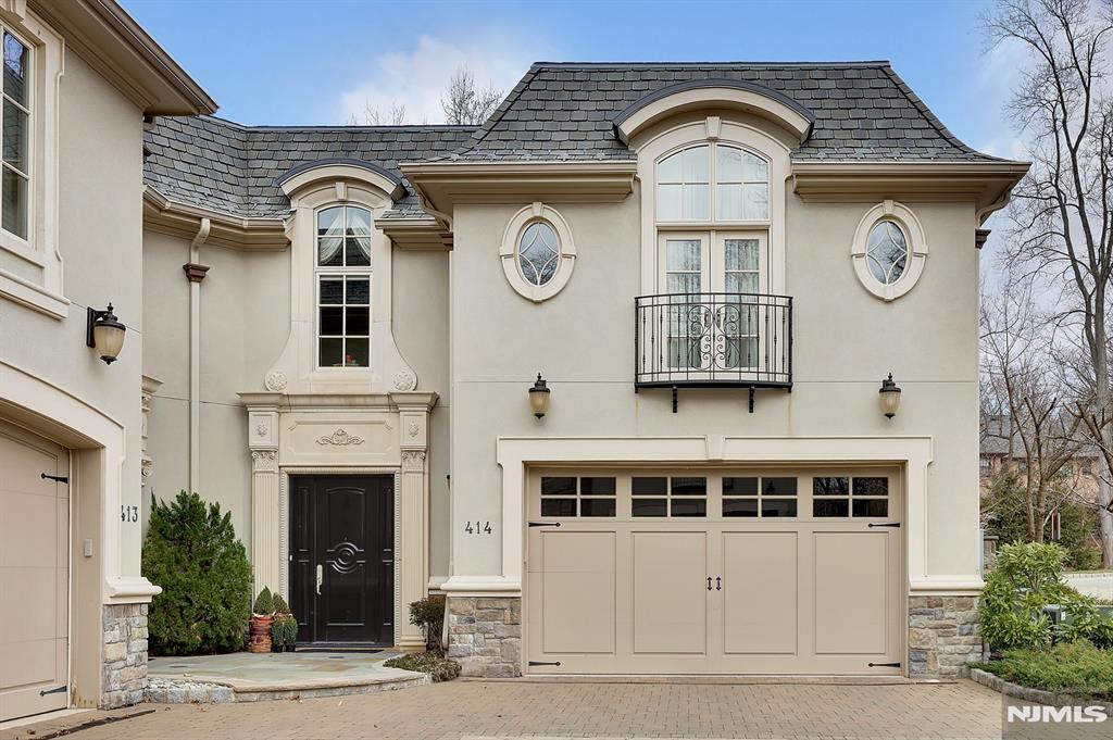 EXCEPTIONAL ELEGANCE IN THIS STUNNING BELLAIRE TOWNHOUSE, NESTLED IN THE HIGHLY SOUGHT-AFTER GATED COMMUNITY NEXT TO ALPINE CC. SURROUNDED BY LUSH GREENERY ON THREE (3) SIDES, THE MOST PRIVATE N SERENE SETTING WITHIN THE BELLAIRE ENCLAVE. THIS HOME OFFERS 6,000 SF OF TIMELESS EUROPEAN CHARM N MODERN SOPHISTICATION. A CHARMING INTERIOR W/ ELEGANTLY DESIGNED CURVED STAIRCASE, BEAUTIFUL HARDWOOD FLOORS, CUSTOM MOLDINGS, N TRIM WORK, N HIGH CEILINGS. OPEN FLOOR PLAN W/ ELEVATOR TO ALL 3 LEVELS. CUSTOM MAHOGANY LIBRARY W/ COFFERED CEILING. GOURMET EAT-IN KITCHEN W/ TOP OF THE LINE APPLIANCES, SUB ZERO N VIKING, W/CENTER ISLAND. DINING AREA, GREAT RM W/FIREPLACE. A CLASSY PRIMARY SUITE W/ A SEPARATE SITTING RM, A SPA-LIKE PRIMARY BR N A GENEROUS WALK-IN CLOSET. 3 ADDITIONAL EN-SUITE BRS, INCLUDING A PRIVATE LOWER LEVEL 4TH BR SUITE. LOWER LEVEL HAS A HOME THEATER N A SPACIOUS FAMILY RM. THIS EXCEPTIONAL LUXURY TOWNHOUSE IS TRULY BEYOND DESCRIPTION AND YOU MUST SEE! Watch the aerial video.