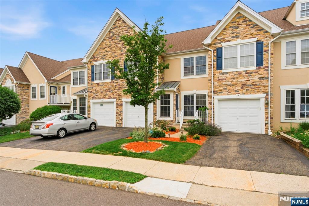 Welcome home to resort-style living at its finest in the highly sought-after Lakeside at North Haledon! Perfectly situated in a prime cul de sac location, this lovingly maintained Belmont model, proudly owned by its original owners, offers 3 BR's, 2.5 BTH's, and a desirable walk-out lower level. Step inside to beautiful wood flooring throughout all three levels, recessed lighting throughout, and updated mechanical systems, including a newer hot water heater & water softener. The main floor features a formal LR and DR, a convenient powder room, and two-story family room filled with natural light that flows into the spacious eat-in kitchen. Sliding glass doors lead to an oversized deckâ€”perfect for entertaining or relaxing outdoors. Upstairs, the spacious primary suite boasts cathedral ceilings, dual walk-in closets, and ensuite bath with a Jacuzzi soaking tub, separate stall shower, and double vanity. Two add'l bedrooms, a full bath, and a conveniently located 2nd floor laundry room complete this level. The finished walk-out lower level offers a versatile great room with sliding doors to a private patio, plus abundant storage space. Enjoy exceptional resort-style amenities, including a clubhouse with a fitness center and billiards room, a pool and hot tub overlooking the sparkling lake, boating and fishing, tennis courts, and beautifully maintained grounds. With an easy commute to NYC, this exceptional home truly has it all. Don't miss this incredible opportunity!