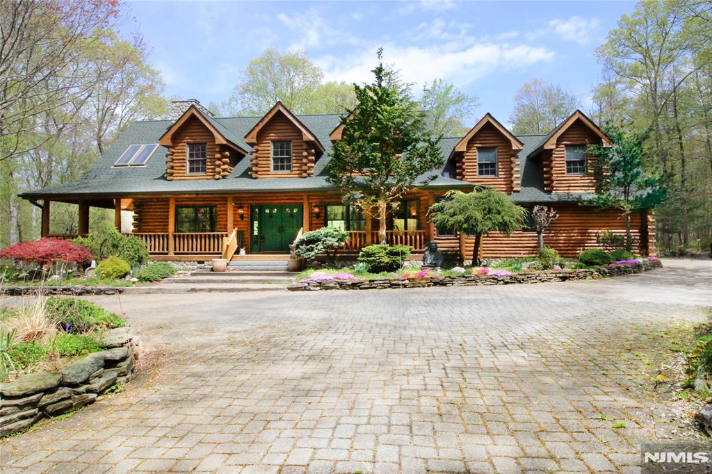 Absolutely stunning! Come see for yourself this exquisite country manor! Whether you are looking for your weekend getaway or full time residence, your search is over. This magnificent estate is less than 2 hours from NYC and yet worlds away. Set on over 17 acres of wooded land, hidden from the road, your private retreat awaits. Secluded yet minutes away from shopping, restaurants, lakes, parks and so much more. The wrap around porch encompasses three sides of this beautiful home with views of your estate. Once inside, the two story fireplace dominates the large open living room which opens to the large kitchen and then to the dining room and sitting area. Upstairs you'll find the open loft space (plans were for a third bedroom and can easily be converted) overlooking the magnificent space downstairs. There's also a bedroom, main bath and primary suite, complete with a second full bath with jetted tub and shower. All told, over 3000 sf of living space. Fully furnished, this home is ready for weekends or full time. The grounds include a "potting shed", a fish pond complete with a bridge, gardens and plenty of parking. Whole house generator, central air and central vac are just a few of the many amenities that make this house so special. This is your dream house! Come see for yourself!