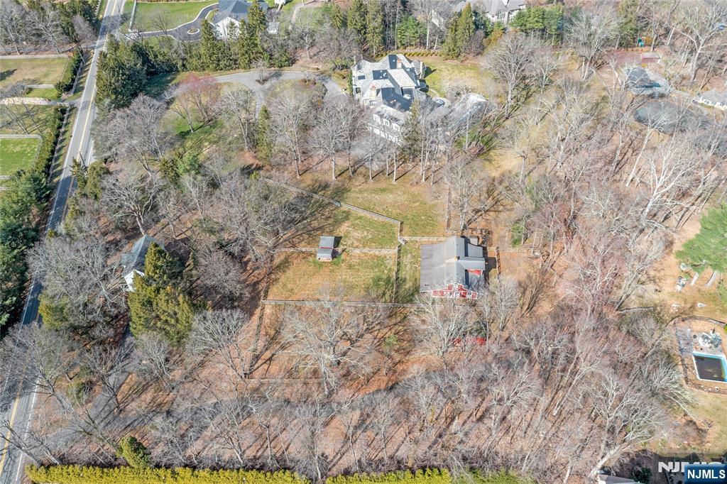 Rare bucolic approximately 3-acre lot, just about 30 miles from Manhattan, in the highly desirable East Saddle River Road section of sought-after Saddle River. Well-located, surrounded by sprawling Saddle River estate properties, offering great supporting value, this piece, which is free of any streams or wetlands, provides maximum usability, as well as the perfect canvas for your vision of your new dream home and/or equestrian oasis. The well-kept barn and paddocks on the property provide the ideal personal equestrian center and may potentially be re-imagined as the perfect car collector's facility or idyllic inspirational artist's studio. The property is only being marketed and sold as land. The existing home and structures on the property will be sold in strictly "as-is" condition, as the value is in the land, and the seller will not be obtaining a CCO.