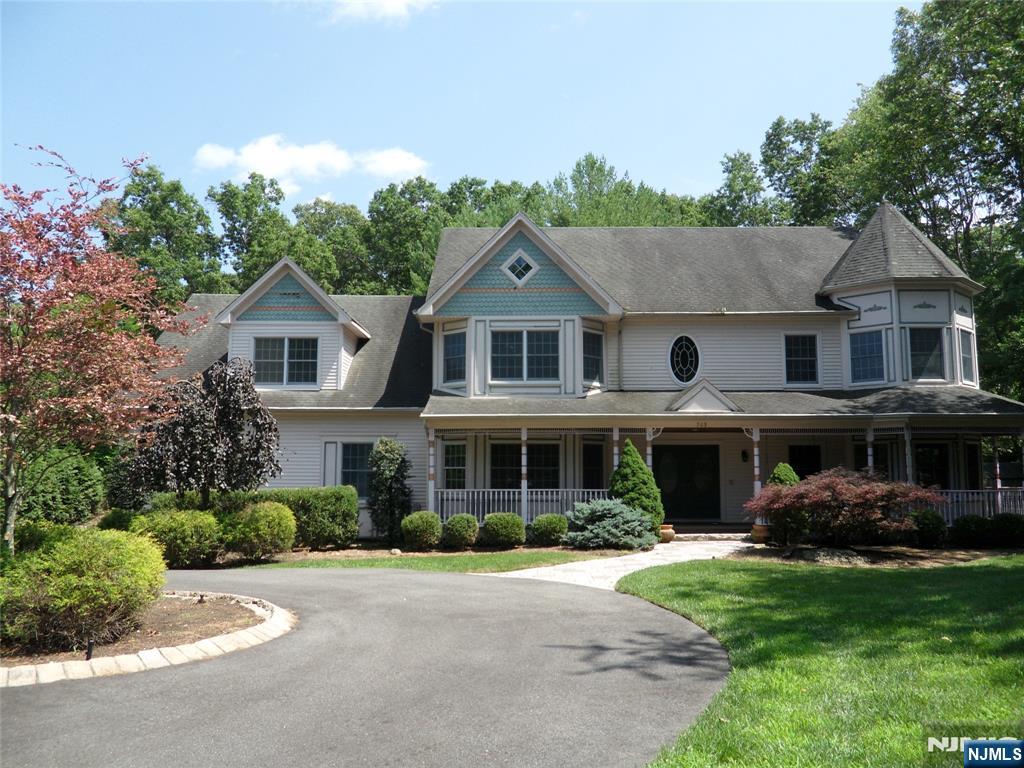 Welcome to this Magnificent updated Victorian Colonial set back approximately 200 feet from the road. This house offers 4 Bedrooms, 5 full bath on a beautifully landscaped 1.5 Acre lot. Inside you will find a wonderful floor plan great for entertaining or daily Life. You enter into a two story Entrance foyer with Marble flooring that leads into a 2 story Large Great Room with Fire place that leads to deck and pool area. Large kitchen with Island and breakfast Nook, Office, Full Bath and Laundry completes the first floor. Second floor offers Master Bedroom, with Master bath and 2 Walk-in Closets, 3 more bedrooms and 2 Full Baths. The basement is Walk out, featuring Movie Theater, Game Room with Fire Place, Exercise Room, Full Bath, Full Kitchen, Utility Room. Too Much to Mention, Don't miss this house.