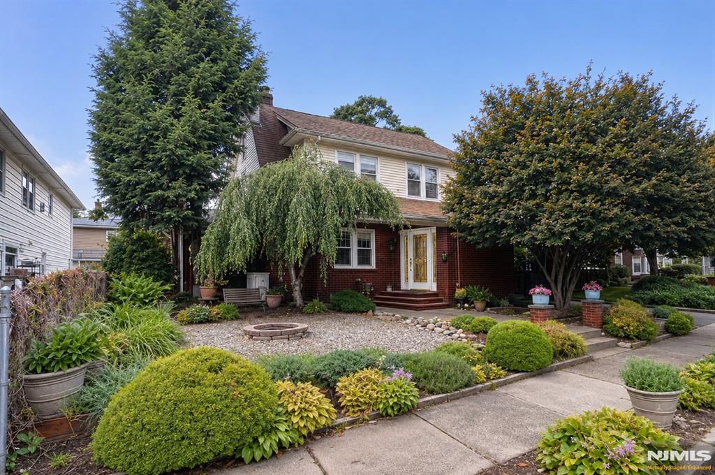 Welcome home to your own private retreat in Fair Lawn, one of Bergen County's most sought-after communities, where tree-lined streets, exceptional convenience, and a true sense of neighborhood make every day feel a little more special. A charming entry foyer welcomes you in before opening to a sun-drenched main level, where rich hardwood floors, a cozy gas fireplace, and abundant natural light create an inviting living room that flows seamlessly into the formal dining room overlooking the backyard. Just beyond, a private den offers the perfect space for a home office, library, or peaceful retreat. At the heart of the home, the expansive eat-in kitchen features stainless steel appliances, a center island, breakfast nook, and a bold designer-inspired powder room. Outside, enjoy a backyard designed for making memories, where a spacious patio flows to an expansive deck and level lawn, creating distinct spaces to entertain, relax, and play. The detached 2-car garage even offers its own screened-in retreat. Upstairs you'll find three spacious bedrooms, including a serene primary suite, plus a secondary bedroom with private access to a finished walk-up attic ready to become a reading loft, office, playroom, or dream closet. The finished basement offers a spacious common area, two bonus rooms, storage, and an unfinished laundry area with future bathroom potential. Situated near transportation options into Nyc, making commuting a breeze. The only thing missing is you