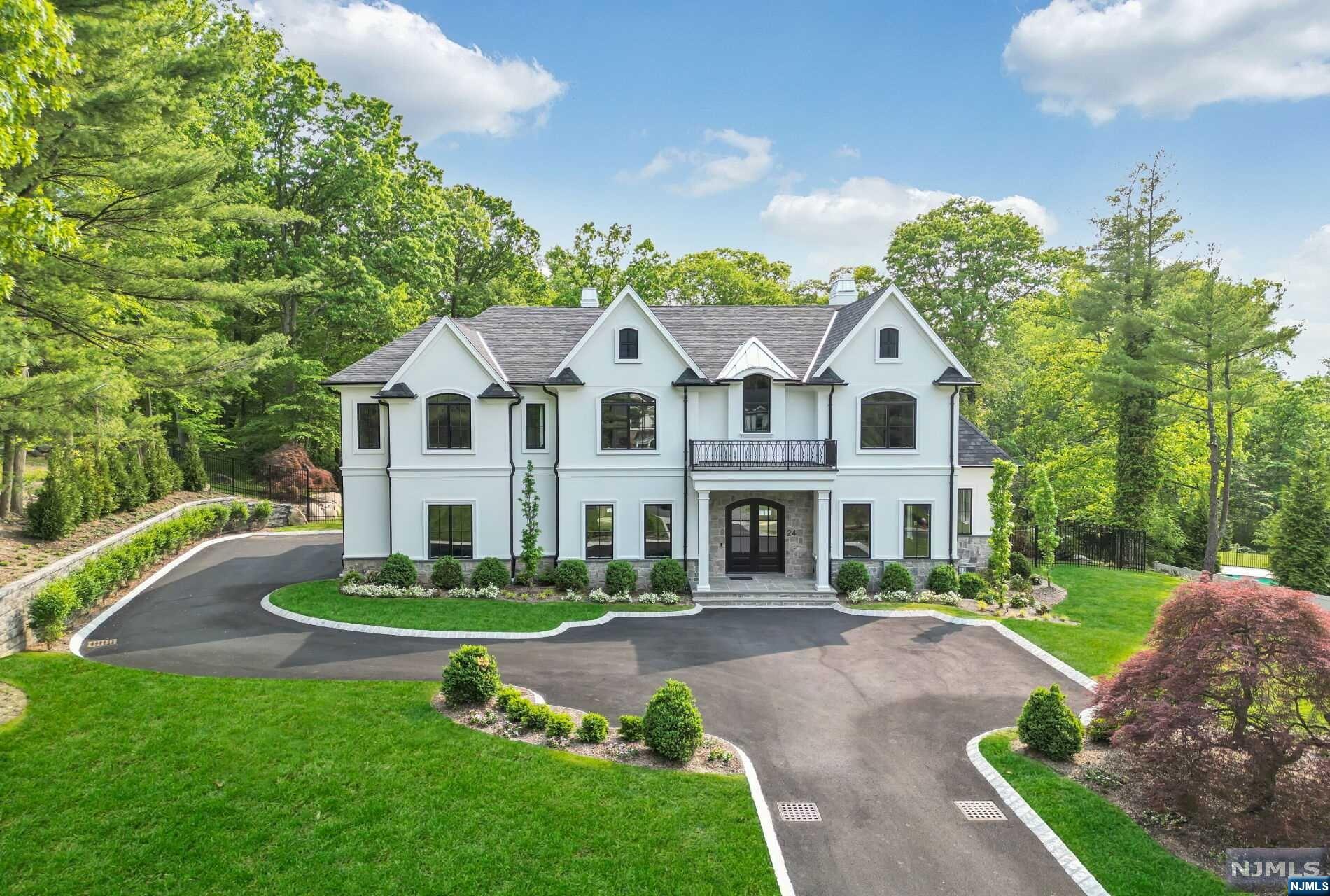 WELCOME TO THE EPITOME OF LUXURY LIVING! This brand new architectural masterpiece, nestled in the highly sought after Alpine, NJ, offers the perfect blend of style, comfort & sophistication. This exquisite home boasts sleek contemporary design, featuring clean lines, expansive windows, & high end finishes throughout. Experience the grand scale & showstopper 1st floor featuring over 1000 SF in the Bespoke Chef's MEIK & Great Room w/ 2 Wetbars & Fireplace. The space features a wall of windows & doors open to an oversized stone terrace, saltwater pool, spa & outdoor kitchen! Gorgeous heated garage opens to mudroom/cabana. Five ensuite bedrooms w/ WICS on 2nd, including STUNNING Owner's Suite! Finished LL w/ 2 staircases & bedroom suite. Experience the prestige that comes w/ residing in one of the country's most coveted neighborhoods, without sacrificing your financial freedom because of the low taxes. Embrace the modern luxury lifestyle in this exceptional home. Ranked #1 NJ School!