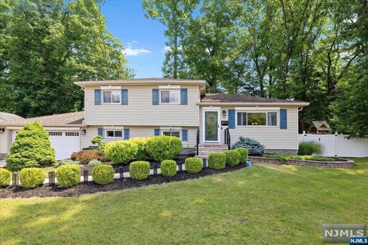 Welcome to this beautifully updated split-level home with fantastic curb appeal, located in a quiet Montvale neighborhood. On the main level, gleaming hardwood floors and a picturesque large window bring warmth and sunlight to the open concept living room and dining room. The newer kitchen features stainless steel appliances and granite countertops with a breakfast bar. Upstairs, find three bedrooms and an updated modern-farmhouse style bathroom. Spacious walk-out lower level family room/rec area, half bath, large crawl space, and a convenient mudroom leading to the two-car garage. The fully-fenced, landscaped backyard has so much to offer: entertain on the paver patio with cozy gazebo and fire pit, or lounge on the sun deck while kids play on their swing set. A large shed provides abundant storage. Montvale offers top-rated schools, first-class shopping, and proximity to major highways/NYC commuting. Don't miss the chance to enjoy all this before summer is over!
