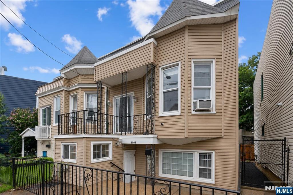 Welcome to this charming 3-bedroom, 1-bath single-family duplex home in downtown North Bergen. This move-in-ready home blends timeless character with modern updates. The main level features a bright living room with a wood-burning fireplace, hardwood floors, an updated kitchen, and a full bath. The walkout lower level includes a laundry area with access to the backyard patio and storage shed. Upstairs are three spacious bedrooms with hardwood floors, including a primary bedroom with its own fireplace. The primary bedroom features approximately 8.5-foot ceilings, while the two additional bedrooms offer approximately 9.5-foot ceilings, creating an open and airy feel. The second floor also provides access to an elevated front patio, perfect for enjoying your morning coffee or relaxing outdoors. Conveniently located near John F. Kennedy Boulevard, with easy access to shopping, restaurants, parks, schools, major highways, and public transportation.