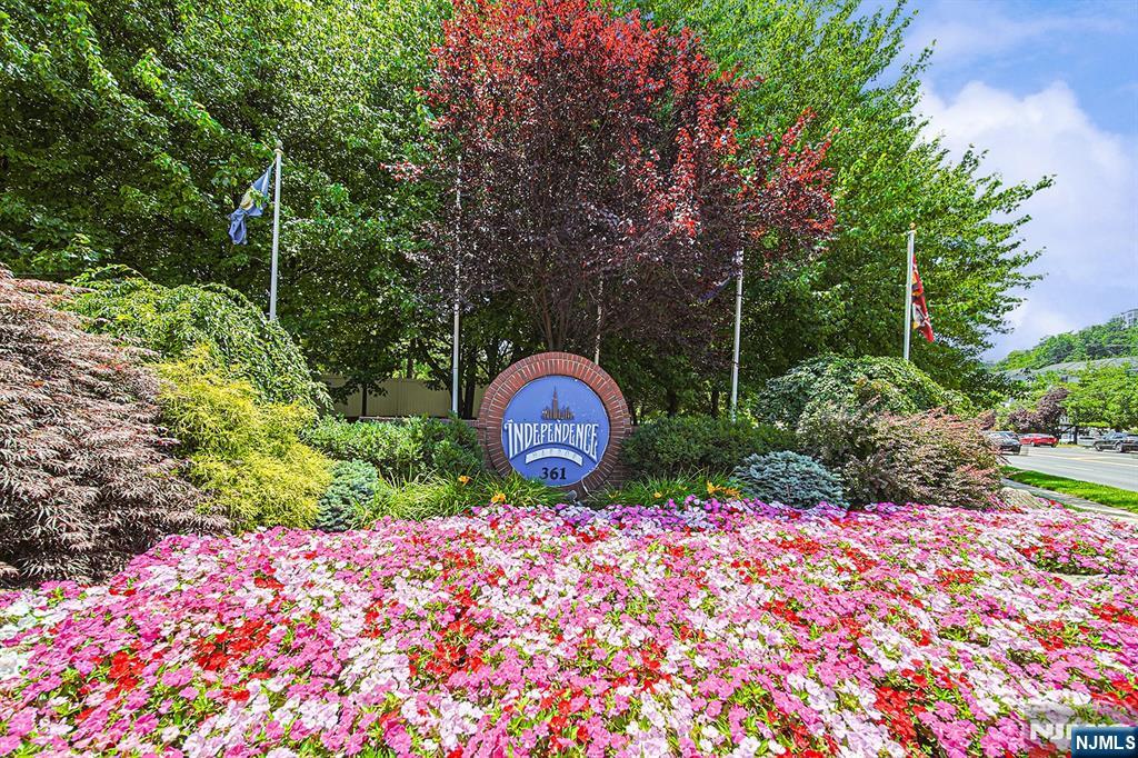 Welcome to 306 Smith Ct., a beautifully renovated residence in Independence Harbor, Edgewater's premier 24-hour gated waterfront community. This spacious 1,504-square-foot home offers 2BR's & 2FBATH's, open floor plan, tranquil first-floor garden views, and a private front porch. The updated open-concept Kitchen features custom cabinetry and premium appliances, while hardwood floors flow throughout the home The primary suite includes oversized walk-in closet with custom organizers and a spa-like en-suite bath with a dual vanity and a deep soaking tub. Residents enjoy exceptional amenities, including a private clubhouse, fitness center, heated pool, tennis courts, and direct access to the Hudson River waterfront promenade. Ideally located near City Place, the home offers convenient access to shopping, dining, and an easy commute to Manhattan via the community ferry shuttle or NJ Transit bus service. The property also includes one garage parking space and one additional outdoor parking space.