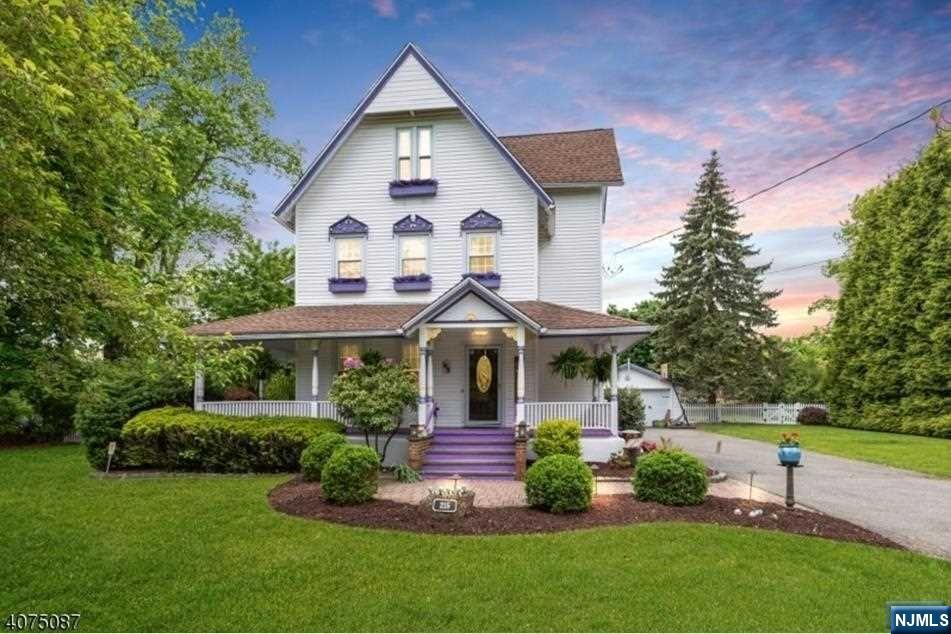 Queen Anne homes-famous for their wrap-around porches. This home seamlessly integrates modern amenities, a state-of-the-art kitchen w/ SS appl., granite counters & double oven, extra-deep sink & custom cabinetry.The Din Rm's ample size allows for large gatherings. LR invites relaxation & conversation. The family room, off the kitchen, with wood burning stove. The sliding glass door leading to the patio allows seamless indoor-outdoor living .Primary bdrm offers large walk-in closet, ample storage & laundry area. All the bedrooms are of generous size w/ 1st fl. guest bedroom as a bonus. The finished basement has 8' ceilings with rec rm, & exercise rm, additional storage rm w/ Bilco door to outside. Park-like backyard offers a hot tub, gazebo, KOI pond & gardens. Detached 2-car garage.