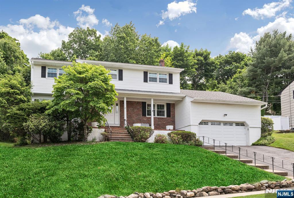 Welcome to this spectacular Colonial in sought-after Chatham Estates! Perched majestically on a beautiful property, this impressive home welcomes you w/a charming front porch, the perfect place to enjoy your morning coffee while taking in the peaceful surroundings. Offering over 2,400 square feet of living space, the thoughtfully designed floor plan is ideal for both everyday living & entertaining. Spacious foyer opens to a sun-filled Formal Living Room & FDR, perfect for hosting parties.. The large eat-in kitchen features abundant wood cabinetry, granite countertops, & a separate dining area. Inviting Family Room offers easy access to private backyard through SGD, creating a seamless indoor-outdoor lifestyle. A versatile bonus room above the garage provides endless possibilities for a home office, playroom, media room, or guest space. A convenient 1st floor laundry room, powder room & access to the two-car garage. Upstairs, you'll find four generously sized bedrooms & two full baths, including a spacious primary suite w/updated private bath & walk-in closet. Hardwood floors on both levels. Additional highlights include basement storage, central air (2 yrs old), roof (5 yrs old), furnace (5 yrs old), whole-house fan, & 200-amp electrical service. Near shopping, restaurants, NYC express park & ride transportation, boating, hiking trails, & recreational activities, this exceptional home offers the perfect blend of comfort & convenience.