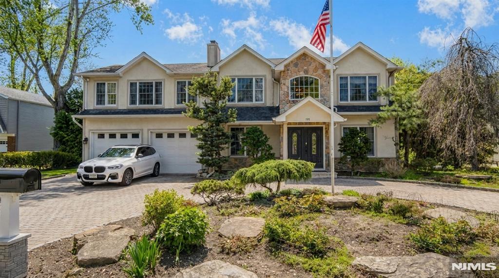 Located in the sought-after East Hill section of Cresskill, this stunning Colonial offers approximately 4,400 square feet of beautifully designed living space. The main level features an updated eat-in kitchen with Sub-Zero and Viking appliances, custom cherry cabinetry, granite countertops, a large center island, and breakfast area with access to the backyard deck. Formal living and dining rooms, a spacious family room, and multiple fireplaces. The second floor includes a luxurious primary suite with fireplace, walk-in closet, and spa-like bath, plus an additional en-suite bedroom, two more bedrooms, and a convenient laundry area. A renovated attic and finished basement with full bath, separate entrance, and flexible bonus space provides endless possibilities as office, recreational space, etc. Hardwood floors, vaulted ceilings, a paver driveway, and a two-car garage complete this exceptional home.