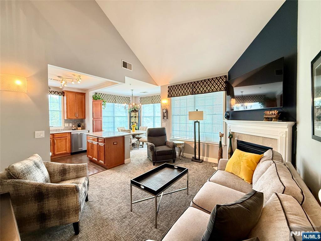 LIVE THE GRANDE LIFE! INTERIOR PHOTOS COMING SOON! Beautiful "Hickory Model" 4th flr 2 bedroom, 2 bath Penthouse w/Loft. 1553 S.F elegance. Cathedral ceiling! Private, quiet end unit. Beautiful community views from all rooms. Featuring 2 bedrooms w/WIC in each bdrm. Two full baths! Kitchen w/ ctr island, new counter tops, newer stove, fridge & dishwasher, upgraded cabinets. Spacious LR w/gas FP. Separate dining area with plenty of windows and light. Spacious Loft which can be used as another bedroom, office or whatever your heart desires. Laundry rm accommodates full size W/D side by side! Newer water heater. You will fall in love with this beauty! Amazing low Riverdale taxes. One car garage assigned parking space underneath bldg. Plus add'l parking. Experience the Grande life with a wealth of amenities, including 2 clubhouses equipped with fitness centers, billiards rooms, conference rooms, party rooms, tennis and basketball courts, 2 swimming pools, and much more! Near major highways, shopping and restaurants. PET POLICY- MAX 2 PETS-35LB WEIGHT LIMIT PER PET.