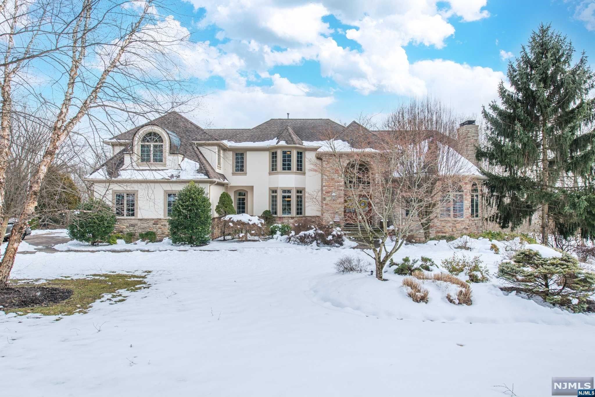 Magnificent estate adorned with brilliant natural sunlight and uncompromising quality and craftsmanship. Gourmet kitchen offers a Thermadore stove, granite center island, Sub-Zero fridge and breakfast area leading to the enormous deck w/views of the breathtaking 2 acre private secluded oasis. Fabulous great room boasts a wall of windows & wood-burning FP & a LR adjourning to the library/study room. Main level in-law suite has direct access outside. The 2nd floor primary Br has a balcony & bathroom suite w/jetted tub, opulent shower, bidet & 3 walk in closets. 3 additional Brs include en suite baths. Incredible walkout basement that has a private theatre room & unbelievable detailed crafted wine/poker room w/a gated bar entrance. Additionally an exercise room, bath, office, game room & billiard room with french doors leading to the extraordinary back yard sanctuary! The yard features an in-ground pool with waterfalls, fountains, a slide, swim up bar, gazebo, and outdoor pavilion!