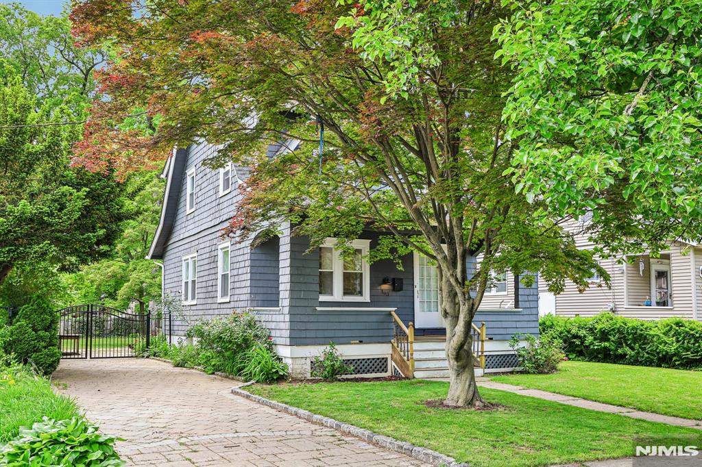 Back on the Market! "The Poplar Dutch Colonial off Prospect". This beautifully maintained 3 bedroom, 2 bath home is nestled in the desirable Fairmount section of Hackensack, where timeless charm meets modern comfort. A classic front porch welcomes you with picturesque views of tree-lined Poplar Avenue. Inside, the inviting family room features a wood-burning fireplace and flows seamlessly into a formal dining room also perfectly suited as a main-level primary suite option. Hardwood floors, updated windows throughout, and a thoughtfully renovated kitchen with breakfast bar and striking herringbone-pattern tile flooring elevate the homeâ€™s character and functionality. Just beyond, a sun-drenched sunroom offers the ideal flex space for a home office, reading lounge, or evening retreat overlooking the expansive, fully fenced backyard. Outdoor living shines with a paver patio and driveway, firepit area, and raised garden beds creating a private setting perfect for entertaining or quiet mornings at home. The second floor features 3 bedrooms, full bath with skylight, and walkup attic access offering storage or future potential. The basement provides additional recreational space, above ground oil tank, and has been updated with a French drain system and cement flooring for peace of mind. Completing the home are a newer roof and sheathing. This is where you want to be. Sale contingent upon sellers securing suitable housing; actively searching.