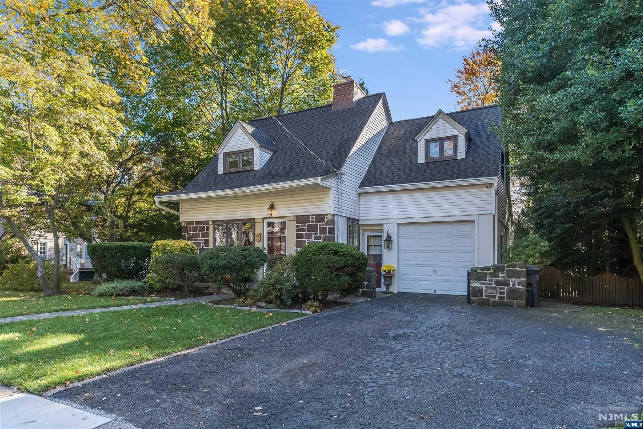Home sweet home!This quintessential Glen Rock Colonial gives you the best of all worlds!Wonderfully expanded & updated,the home boasts 3 BRs & 1 1/2 baths.The inviting front porch welcomes you to a formal living rm warmed by a beautiful fieldstone fireplace & on to a formal dining rm w/a charming built-in corner cabinet.An updated eat in kitchen complete w/Viking range,granite counters & subway tile backsplash opens to a sundrenched family rm w/sliding glass door to a deck overlooking the expansive,private backyard-perfect for entertaining.A conveniently placed powder rm & mudrm entrance from the attached garage complete the 1st level.Gleaming HW floors continue up to 3 comfortably sized BRs & a beautiful hall bath.On the lower level you will find a terrific rec rm & bright laundry rm w/plenty of storage.Endless updates include a new furnace,hot water heater,roof,gutters & so much more!All this w/Glen Rock's top rated schools,charming downtown dining &shopping & amazing town pool!