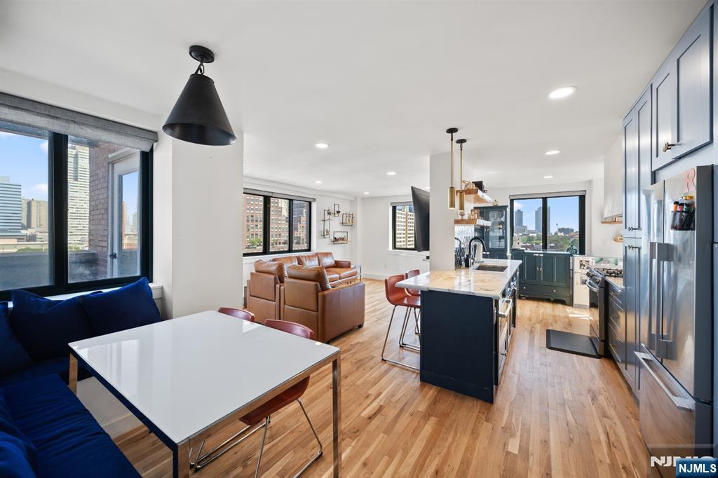 Stunning, fully renovated 2 bed/2 bath corner home with two private terraces and NYC views! The incredible chefâ€™s kitchen features Bosch & LG appliances, an 11ft island, Restoration Hardware lighting, custom live edge wood shelves, Calacatta Vagli marble counters, Carrara marble subway backsplash, and a separate dining area with a custom banquette. The primary bedroom has tons of closet space and an ensuite bathroom. Both bathrooms have been renovated with modern floating vanities, a 66â€ soaking tub, Delta fixtures, and decorative porcelain tile. Also included are custom California closets, in-unit LG washer/dryer, motorized window shades, central AC, RO Water purification system with custom water dispenser, and hardwood floors throughout. The building offers 24/7 concierge/doorman, gym, and sauna. Parking onsite is available for an additional fee. Conveniently located near the Path station, light rail, and bus stop, as well as parks, restaurants, shopping and everything Hamilton Park has to offer.