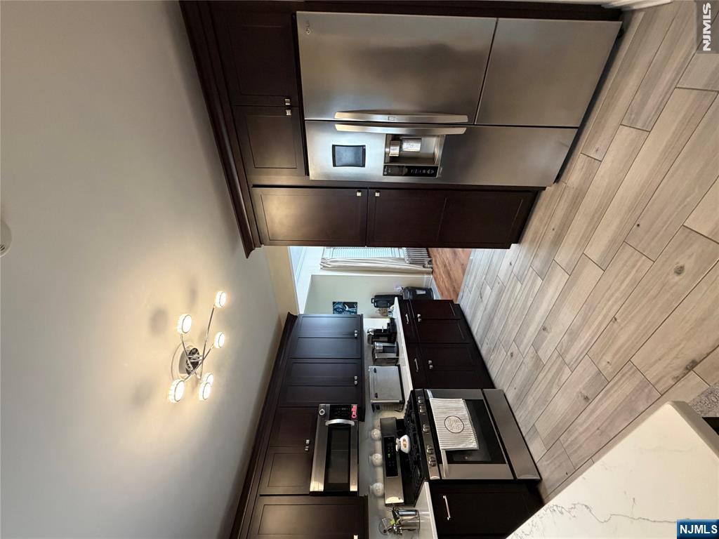 MOVE-IN READY! Beautifully renovated from top to bottom within the last 8 years, this spacious home offers bright, open living spaces, two full kitchens and modern updates throughout. The main level features a large living room, formal dining room, and a modern kitchen. Generously sized bedrooms & closets, updated bathrooms, a finished basement with a summer kitchen and additional living space, plus a finished attic offering endless possibilities for a home office, playroom, or guest space. Enjoy a low maintenance yard, detached garage, and multi-car driveway. Located in desirable Clifton, just minutes from public transportation, shopping, restaurants, parks, and major highways, making it ideal for commuters. Don't miss this turn key home!