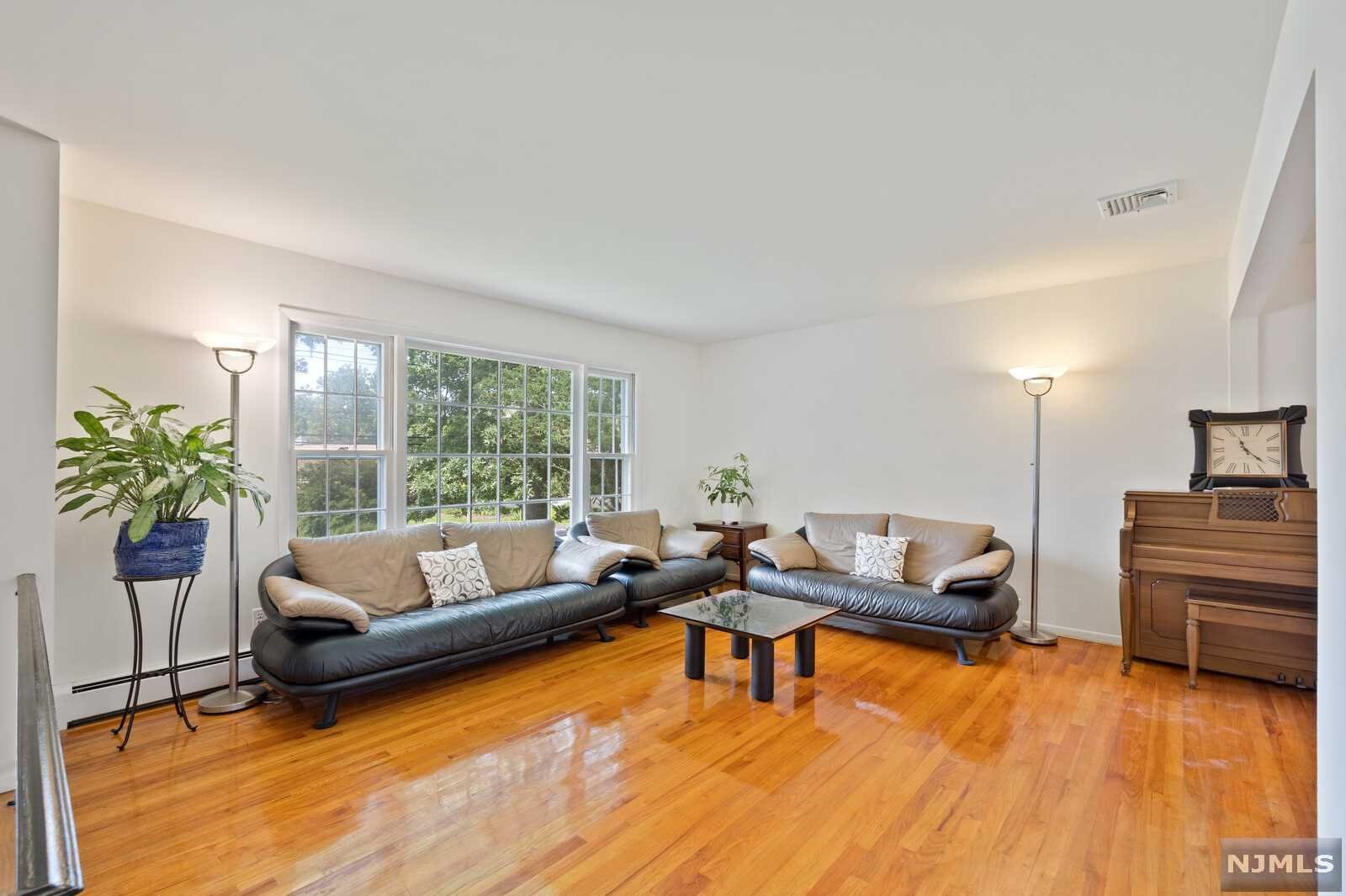 Located in desirable Ridgewood, bright & sunny, fresh painted 3 bedrooms & renovated all 3 baths, 2car garage+ ample storage w/4 parking spaces on drive way, BRAND NEW ROOF & Gutter(2021) W/chimney above roof(2021)& storm door(2021), Hardwood floor throughout, Open kitchen w/ breakfast bar & brand new range hood, water resistant EIR oak floor, finished ground level(2021) includes closet & bath w/plumbing installed & extra space which easy to install a full bath-can be bedroom or family room,*ELECTRICAL PANEL IS BEING UPGRATED TO 200 AMPS W/NEW OUTSIDE ELECTRIC WIRE, NEW STAINLESSNESS LG DISH WASHER WILL BE REPLACED(3/7/22),INCLUDES WATER FILTER SYS. UNDER KITCHEN SINK& BIDET AS WELL, Multi-zone-2 units A/C (2021/2020), heat, newer hot water boiler, Laundry room, fully fenced in rear & side yard w/professional landscapes, near schools & downtown, shops, galore, parks & playgrounds, "Park & Ride" & Train to NYC, Ez access to highways,17, 4, GSPkwy, I-287, I-95. Ribbon Schools.