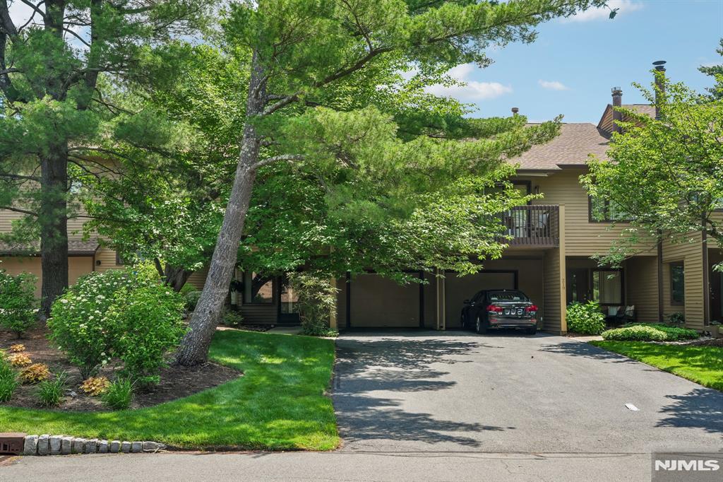 Over 1600SF in this 2 bedroom, 2 bath townhome. Large entry foyer with utilities, walk-in-closet, laundry and garage on first level. Exceptional location with long driveway covered parking and garage. Airy and open living room with fireplace. Dining room has access to shaded deck. Spacious eat-in-kitchen. Main bedroom has walk-in closet, large linen closet and private bath. Community has a clubhouse, pool, tennis. Close to schools and transportation.