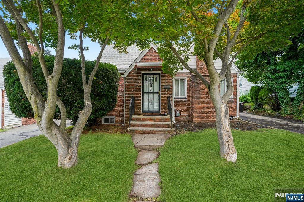 Welcome to this lovely Cape Cod-style home offering a comfortable and functional layout. The main level includes a warm and inviting living room with a cozy fireplace, an eat-in kitchen, a spacious formal dining room, one spacious bedroom, and a full bathroom ideal for guests or one-level living. Upstairs, you'll find two generously sized bedrooms, offering privacy and flexibility for guests, or a home office. Step outside to enjoy the huge backyard, perfect for entertaining, gardening, outdoor activities, or simply relaxing. This home combines classic charm with versatile living spaces, making it a wonderful place to call home, and also features a finished basement with a recreation room, utility room, laundry area, and a convenient powder room. Close to major highways including the Garden State Parkway, Route 3, Route 46, and Interstate 280, making travel throughout Northern New Jersey and New York City a breeze. Also situated within easy reach of Newark Liberty International Airport, shopping, dining, parks, and other local amenities.