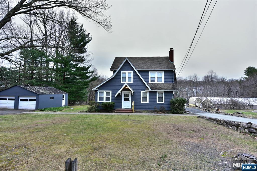 The home is so charming set on a one and half acre lot. Complete with a two-car detached garage and Greenhouse. Bring your imagination possible 3 lot subdivision. The lot is zoned PRDF