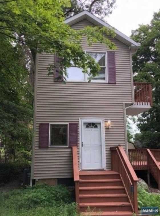 LOW TAXES AND BEACH ACCESS - WHY RENT WHEN YOU CAN OWN AT THIS PRICE. UPPER GREENWOOD LAKE COMMUNITY WITHIN WALKING DISTANCE TO THE BEACH. UPDATED IN 2019- NEW BATHROOM, FLOORS, ELECTRIC, WATER HEATER AND 2 NEW DECKS IN 2020. FIRST FLOOR FEATURES NEW KITCHEN, LIVING ROOM WITH PELLOT STOVE AND SLIDERS TO NEW DECK. SECOND FLOOR HAS 2 BEDROOMS AND DECK WITH PARTIAL VIEW OF GREENWOOD LAKE.CENTRAL AIR AND LARGE NEW STORAGE SHED IS INCLUDED,PARKING FOR 4 CARS.